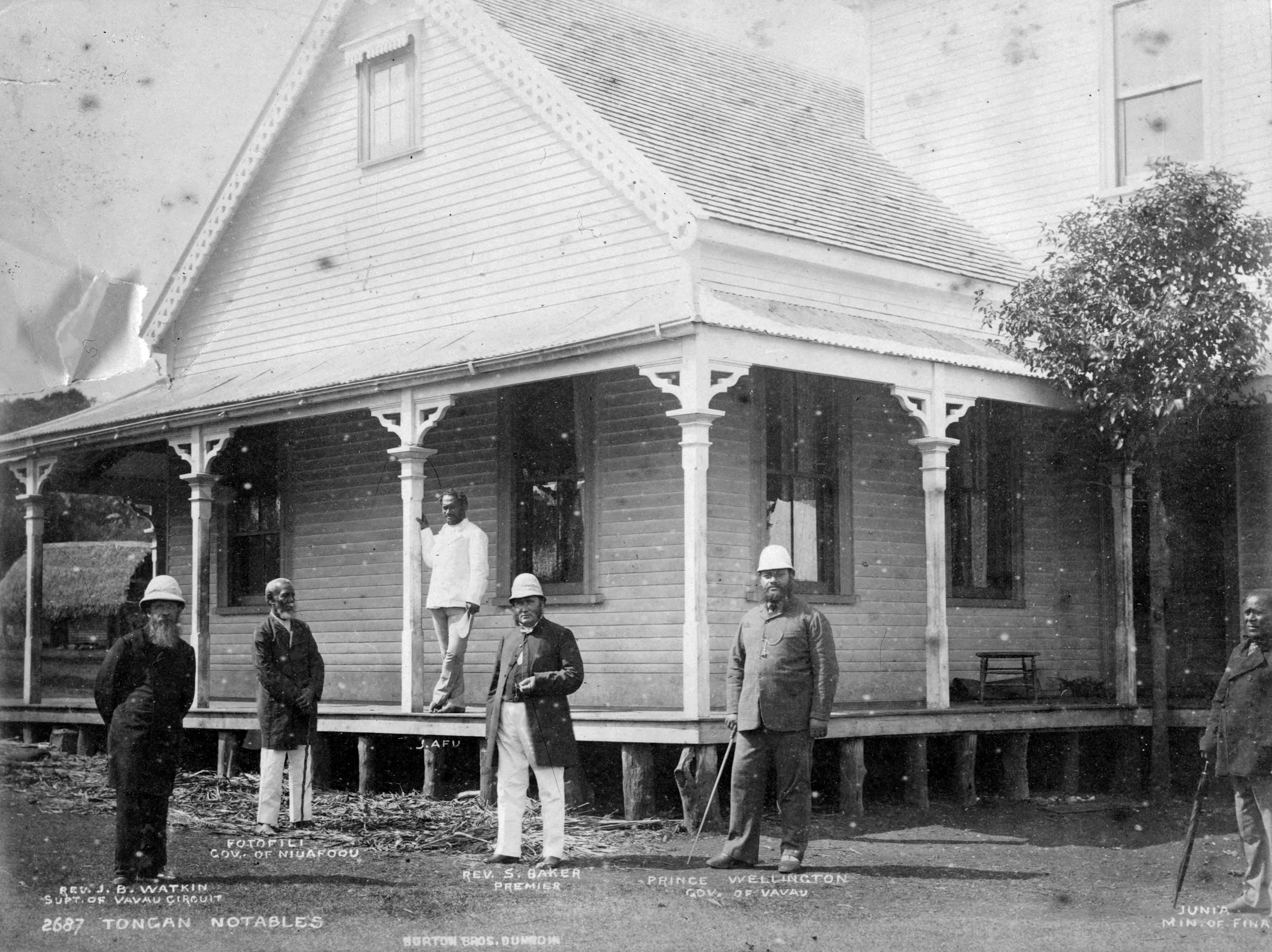 Rev James B Watkin, Fotofili, J Afu, Rev Shirley Waldemar Baker, Prince Wellington and Junia standing outside a house in Neiafu, Tonga