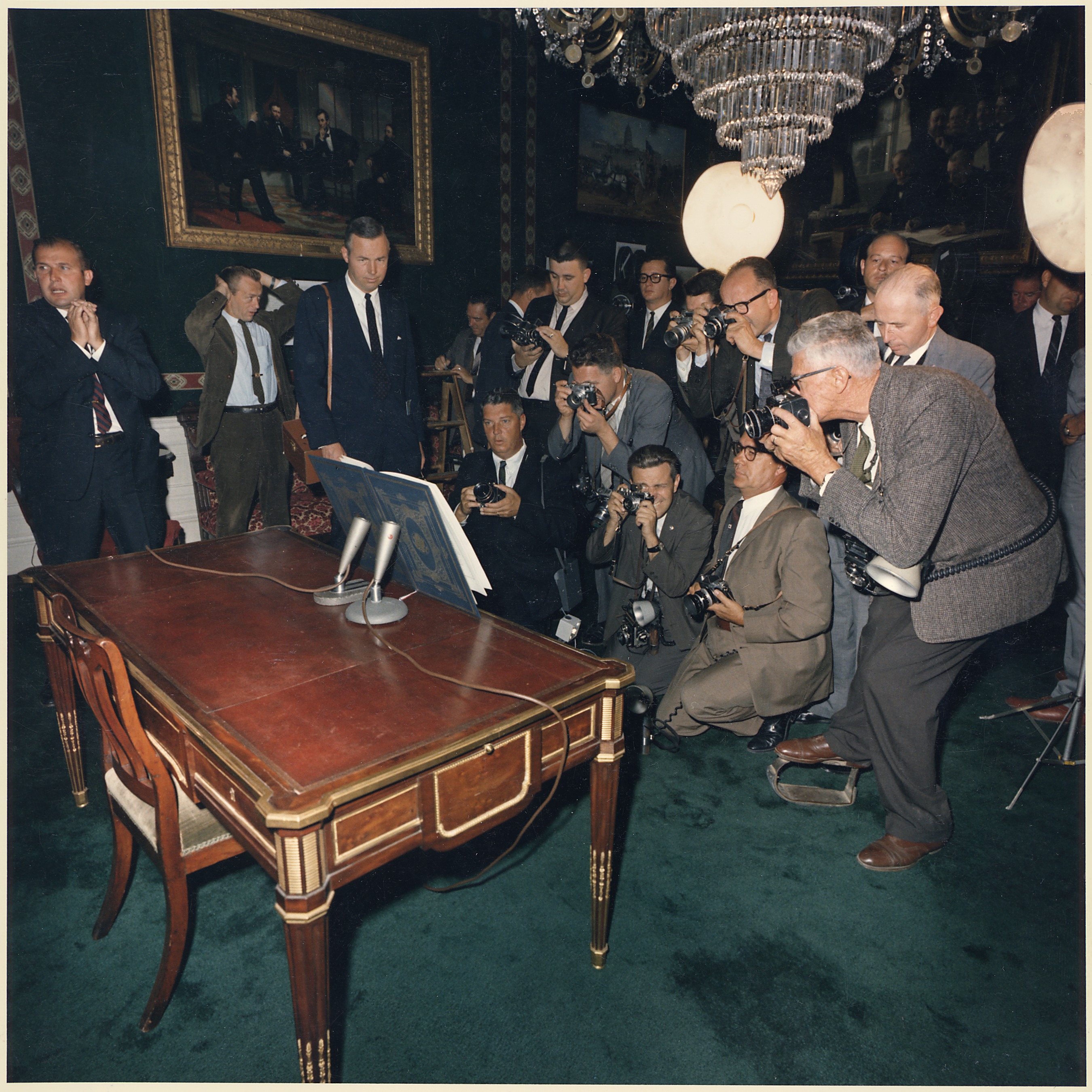 Signing of the Nuclear Test Ban Treaty- Photographing signed Treaty. Photographers, including Captain Cecil... - NARA - 194231