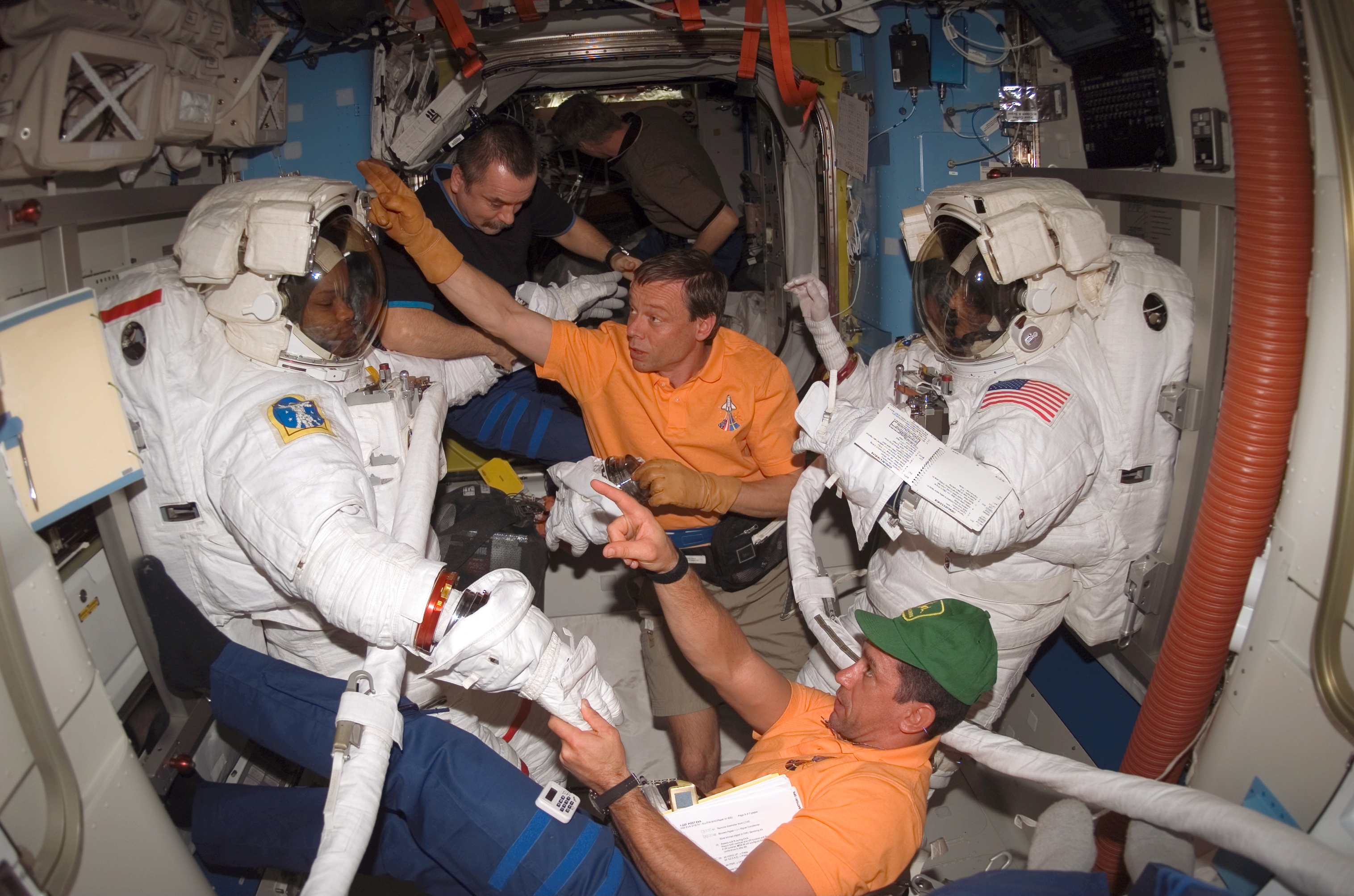 STS-116 ISS-14 EVA 3 Spacewalkers in the Quest Airlock