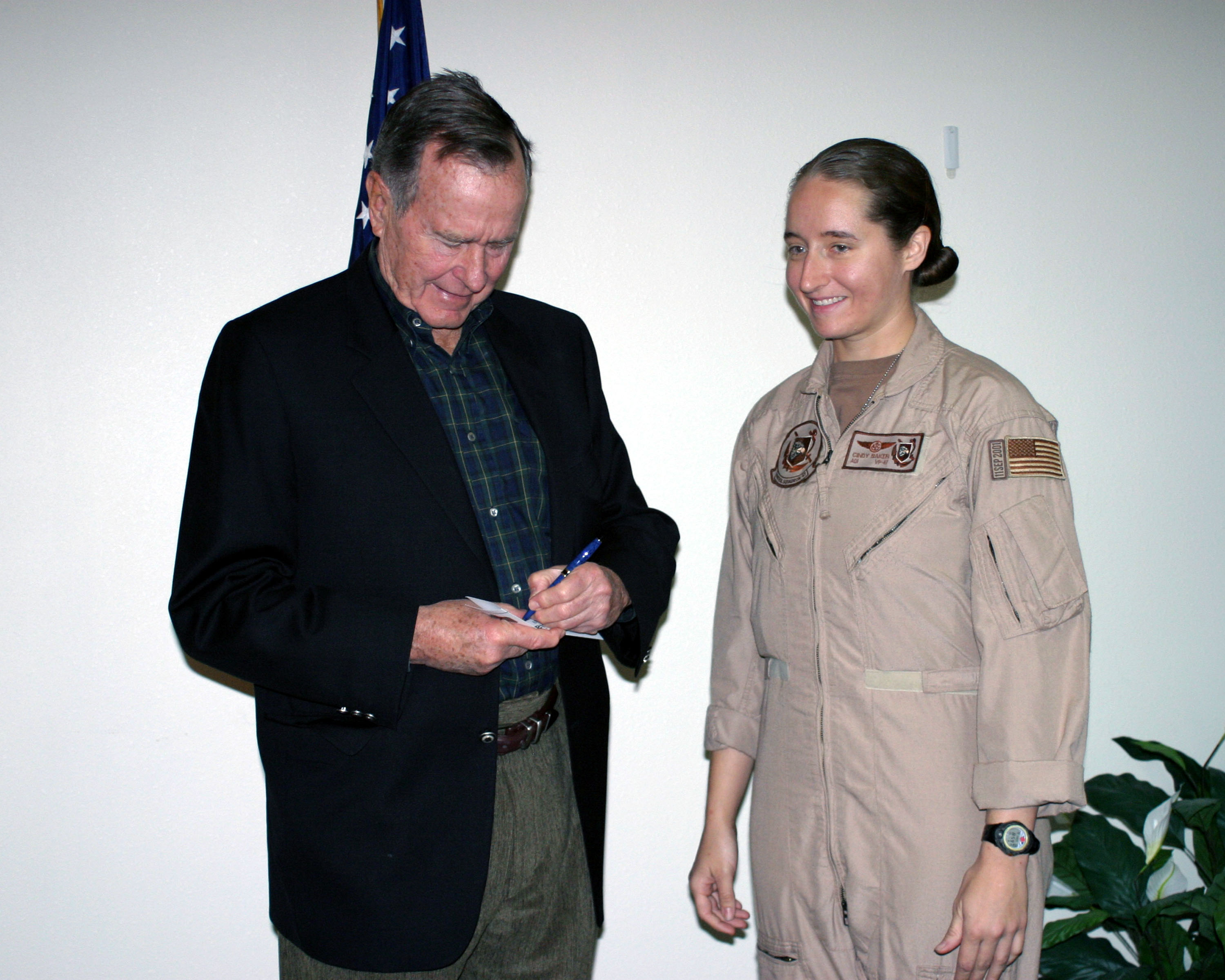 US Navy 060118-N-3207B-088 Patrol Squadron Four Seven's (VP-47) Senior Sailor of the Year, Aviation Machinist's Mate 1st Class Cindy Baker, receives an autograph