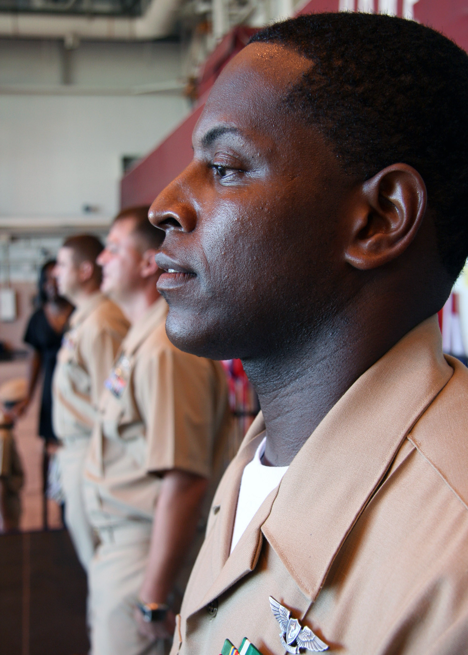 US Navy 070921-N-5277R-006 Chief Aviation Ordnanceman Lorenzo Rodgers patiently waits to receive his anchors during Naval Air Facility (NAF) Atsugi^rsquo,s chief petty officer pinning ceremony