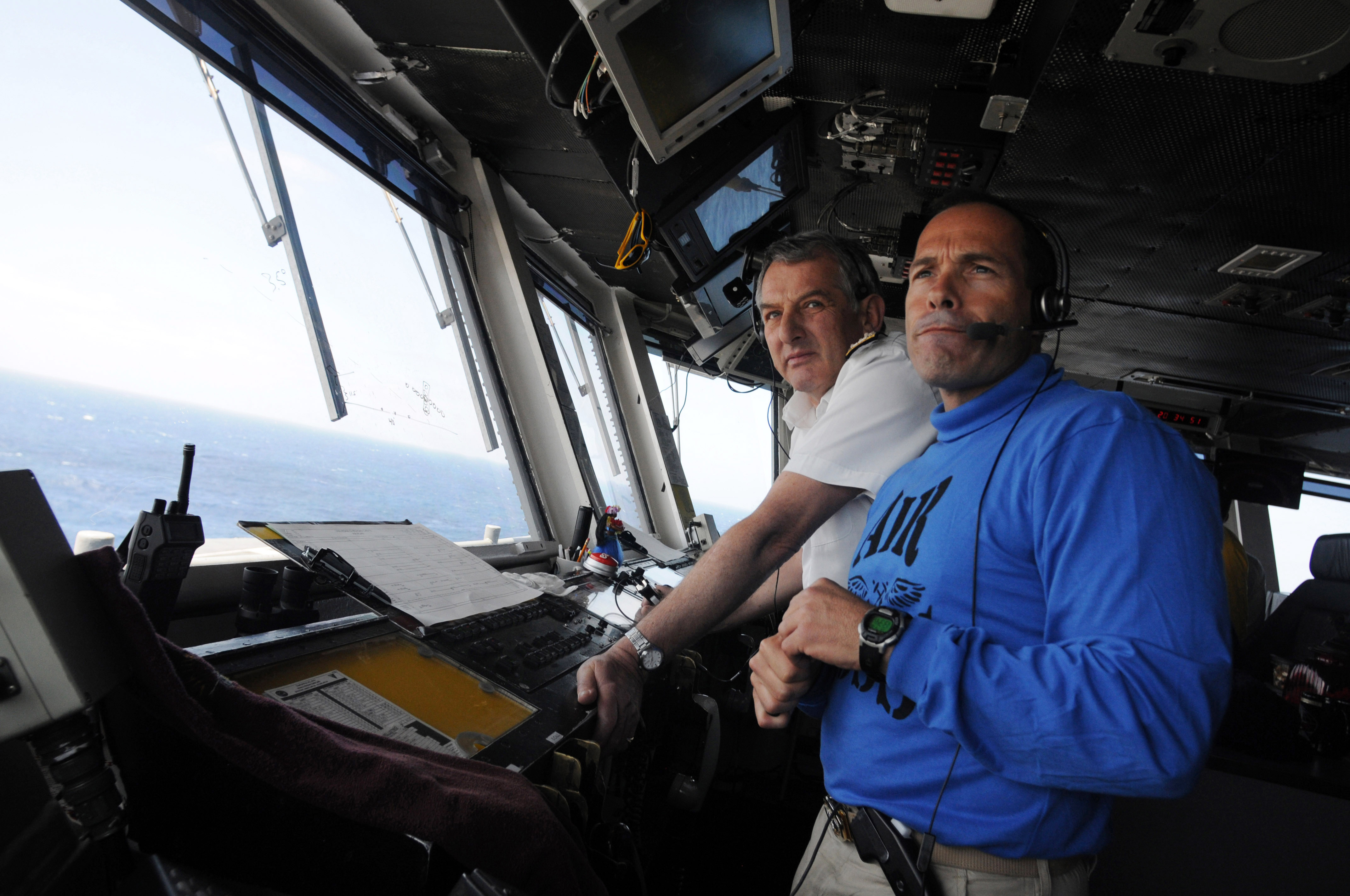 US Navy 090416-N-3610L-260 Capt. John Breast, air boss aboard the aircraft carrier USS Ronald Reagan (CVN 76), and Adm. Sir Jonathon Band, First Sea Lord and Chief of Naval Staff of the Royal Navy