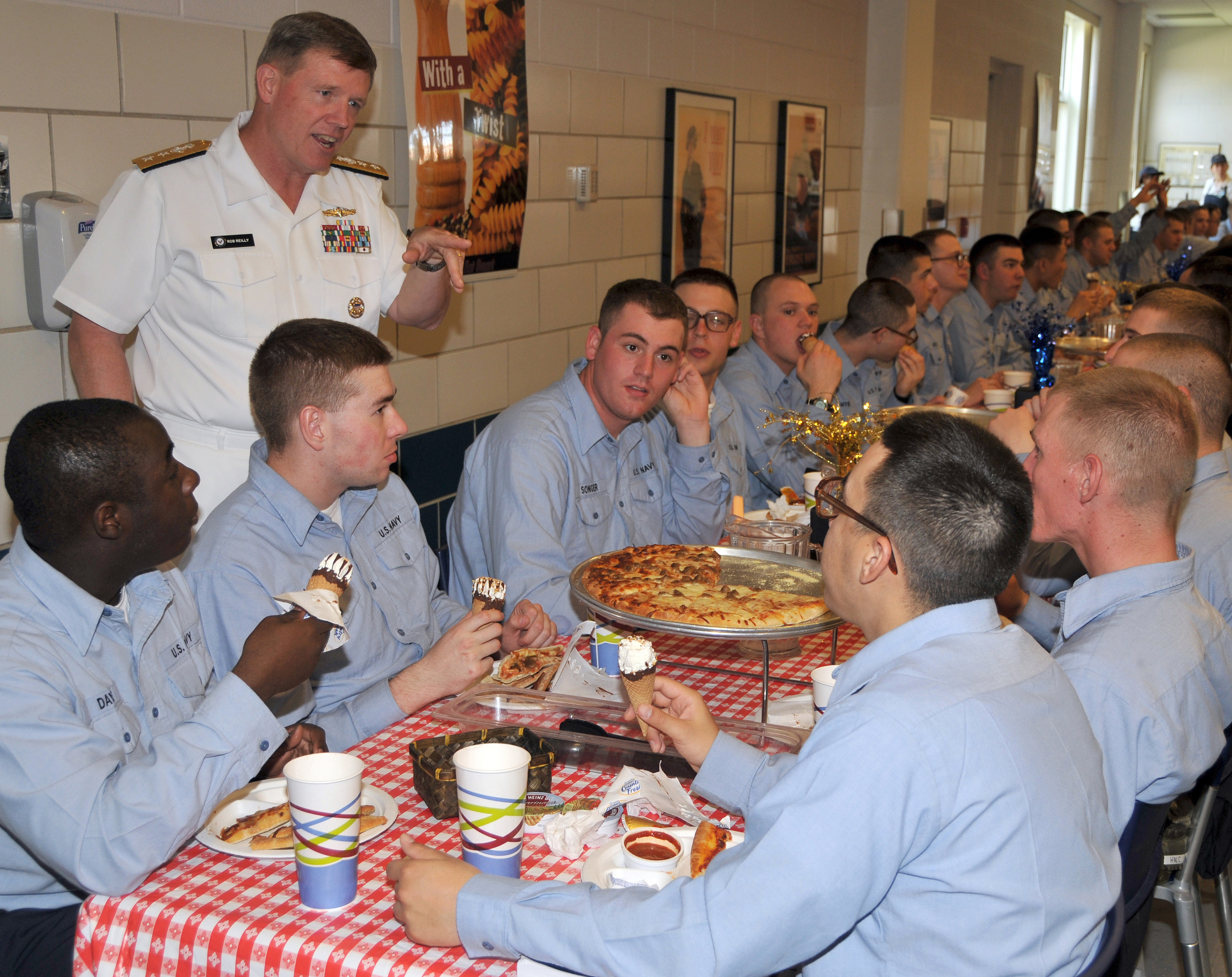 US Navy 090515-N-8848T-300 Rear Adm. Robert D. Reilly, Jr., commander of Military Sealift Command, speaks with recruits during a Pizza Night at Recruit Training Command