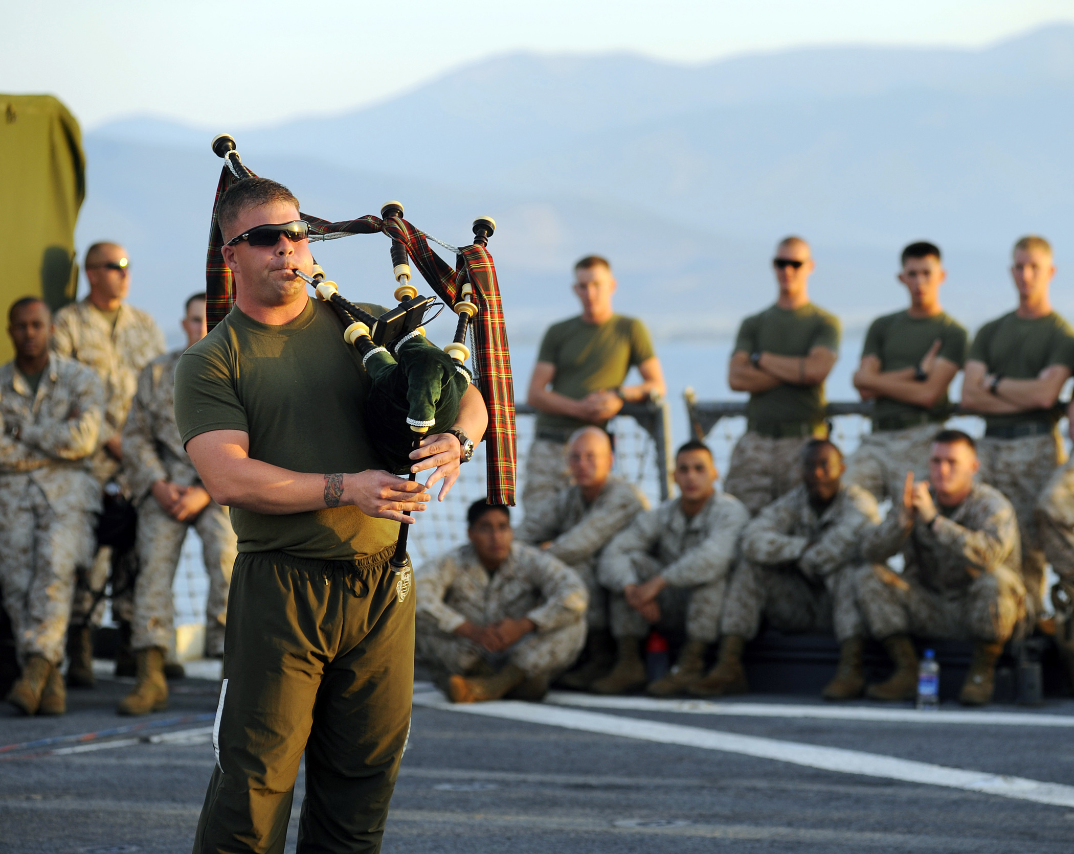 US Navy 090606-N-5345W-377 Cpl. Brian McDonald, assigned to the 22nd Marine Expeditionary Unit (22 MEU) performs a bagpipe medley for the crowd during a morale, welfare and recreation (MWR) sponsored talent show