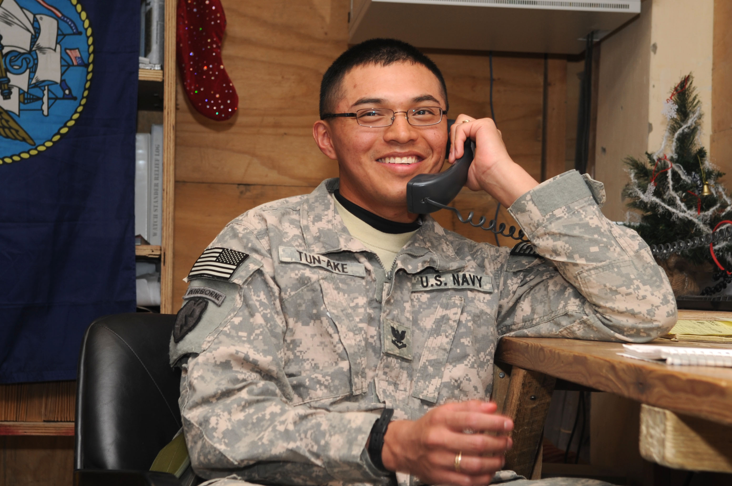 US Navy 091224-F-7418E-007 Petty Officer 3rd Class Luis Tun-Ake receives a surprise telephone call from President Barack Obama at Forward Operating Base Sharana, Afghanistan