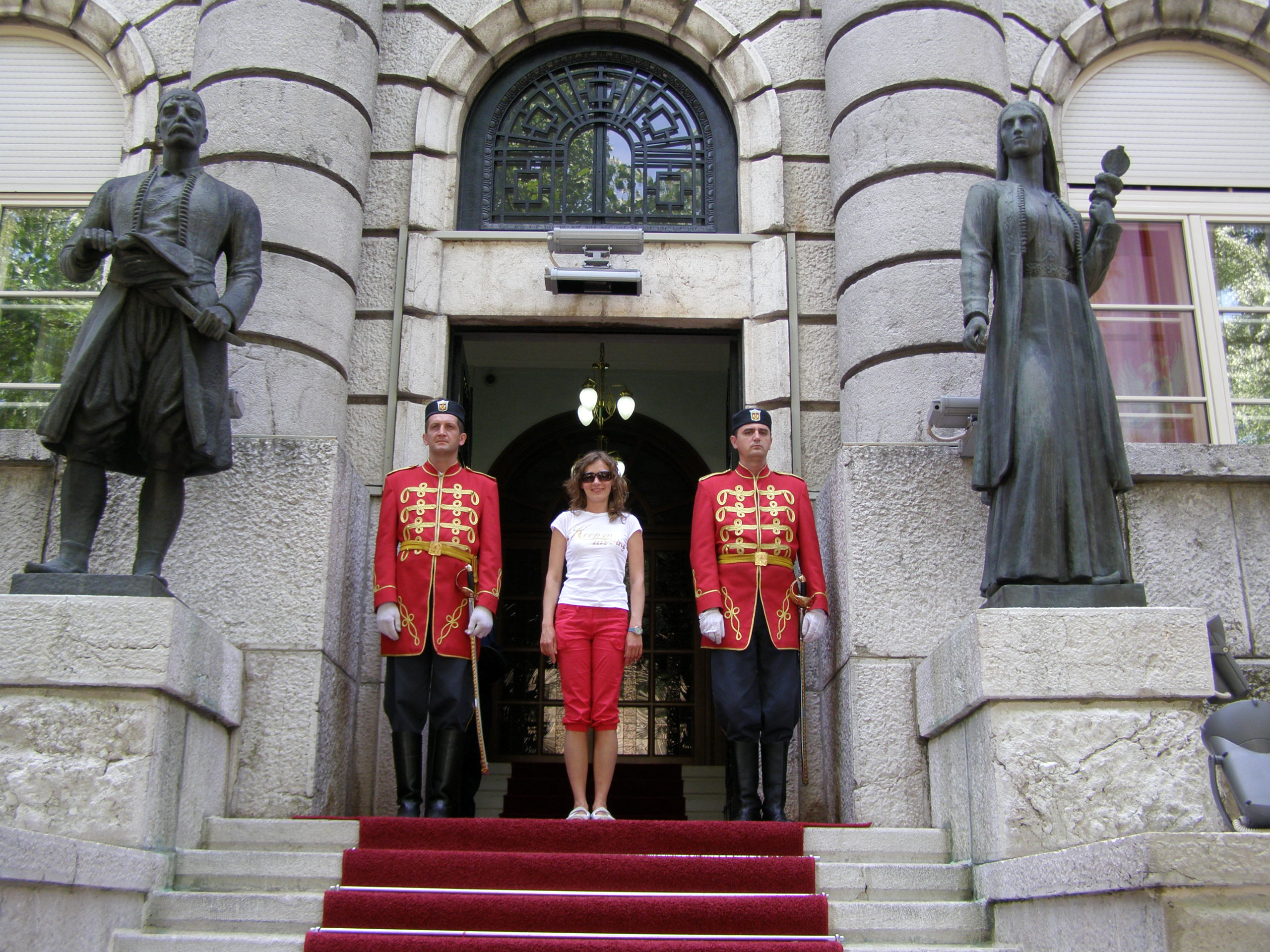 A girl between two men in Cetinje, Montenegro, Europe 2009, picture 4