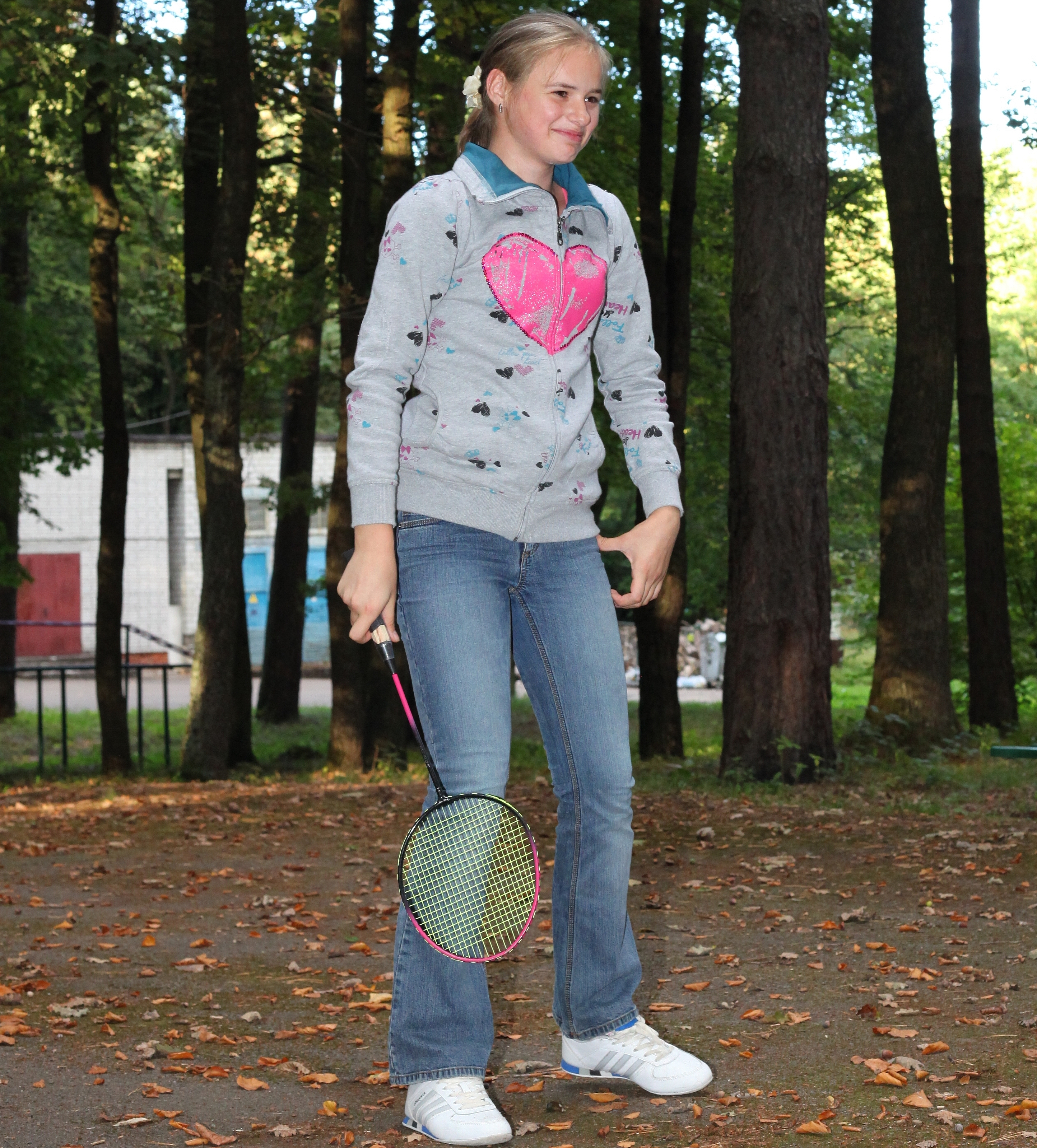 a beautiful appealing smiling Catholic girl playing badminton, photo 27