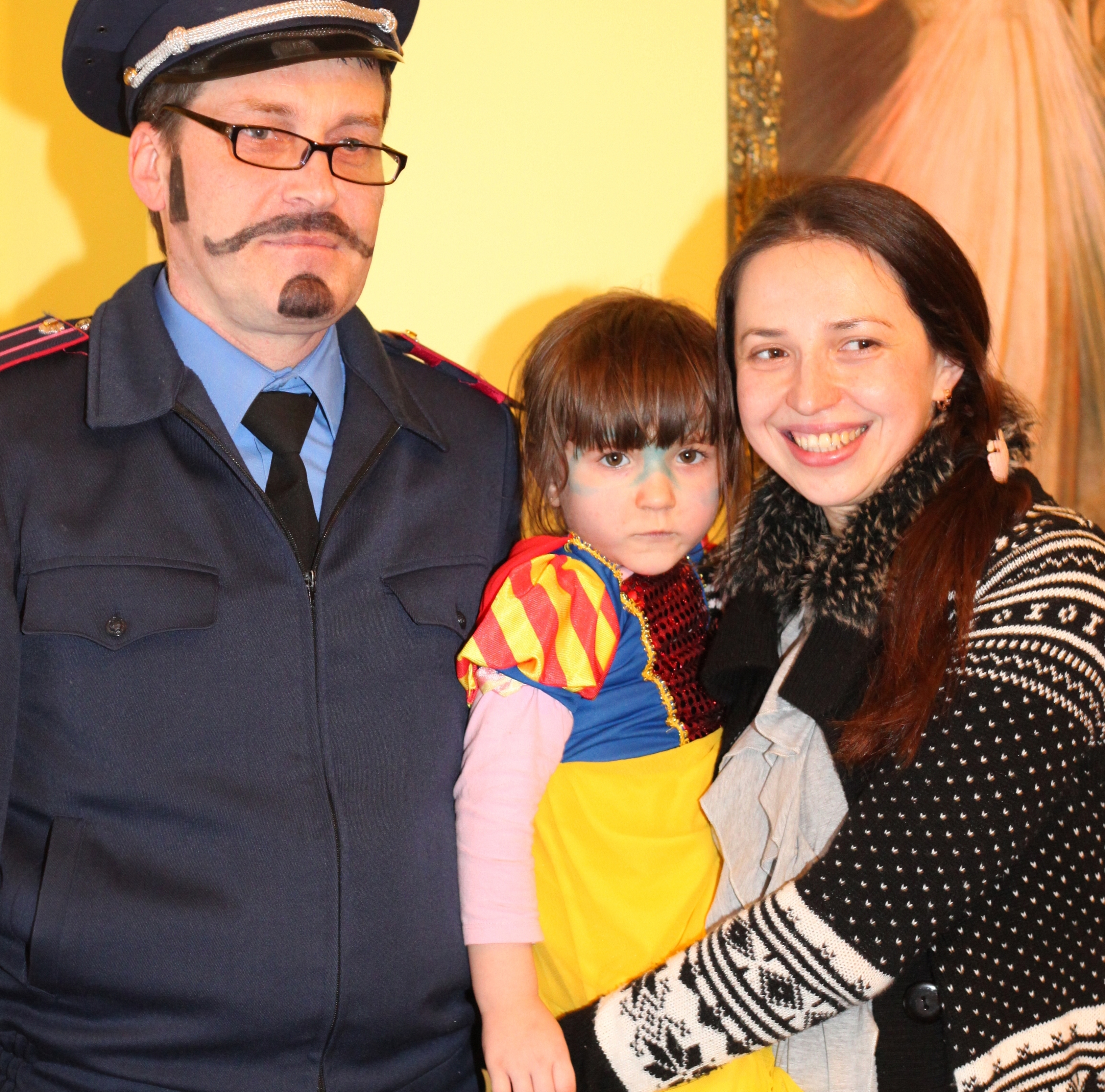 a beautiful brunette Catholic woman with her cute daughter and a man in a Catholic kindergarten, photo 5