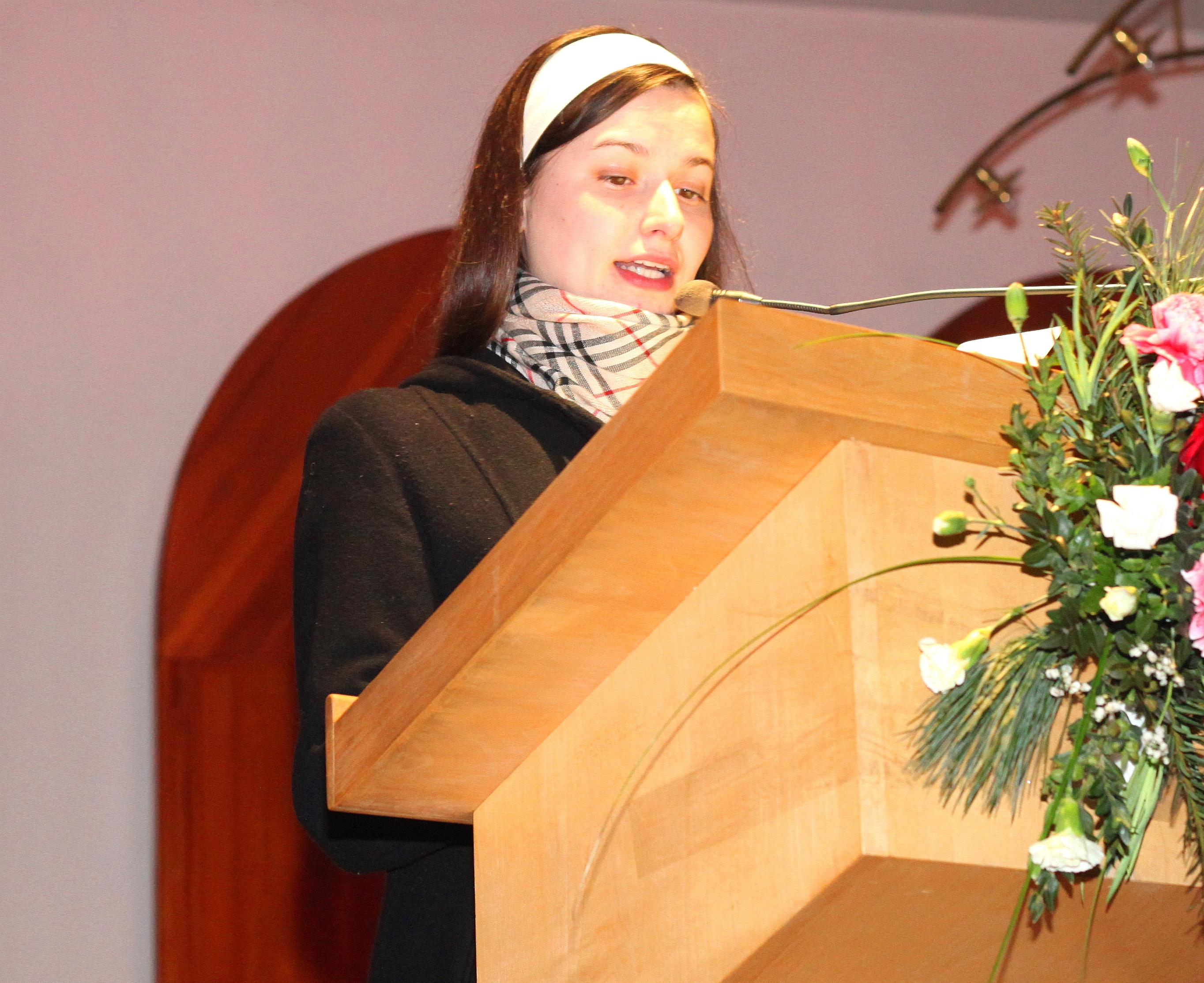 a beautiful Catholic girl reading in a Church