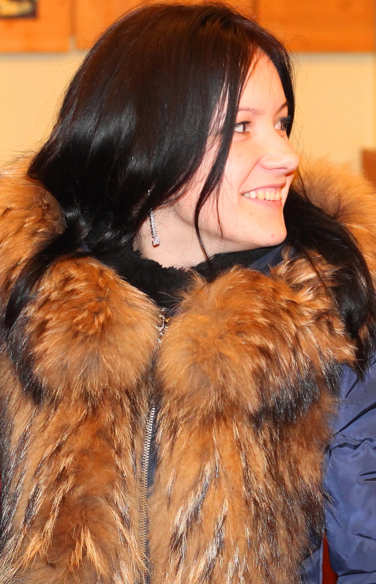 a beautiful smiling brunette girl in a Church