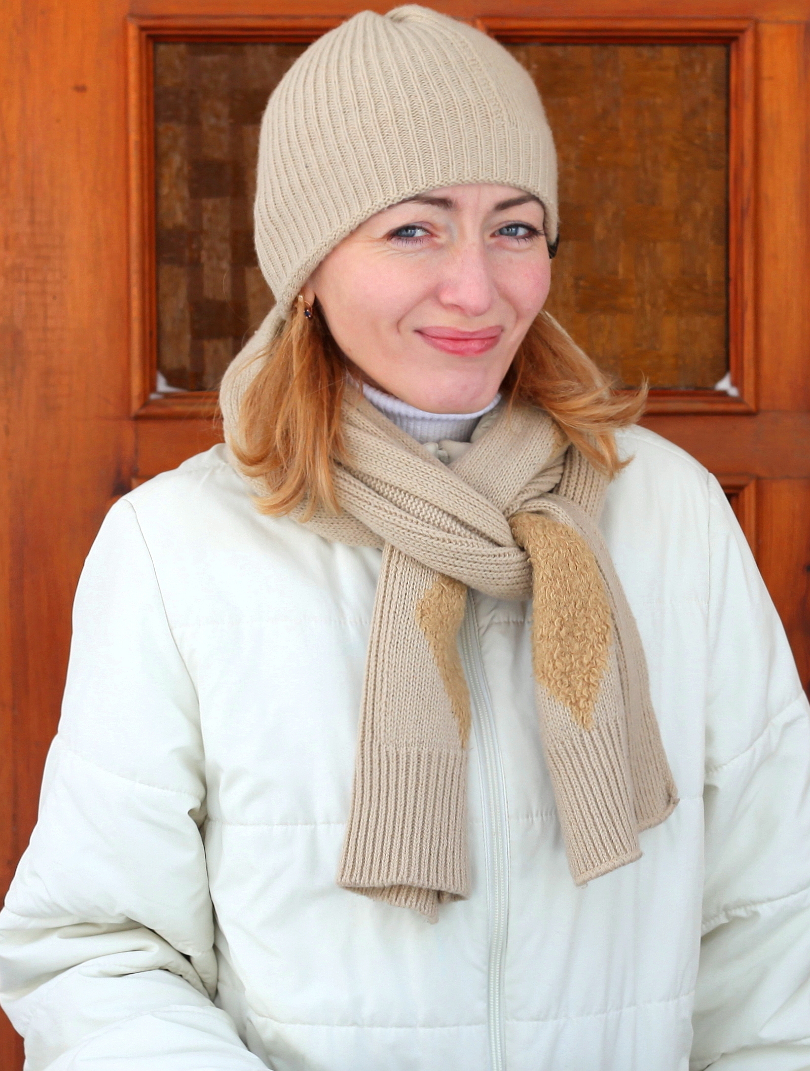 a charming beautiful young blond Catholic woman near a Church