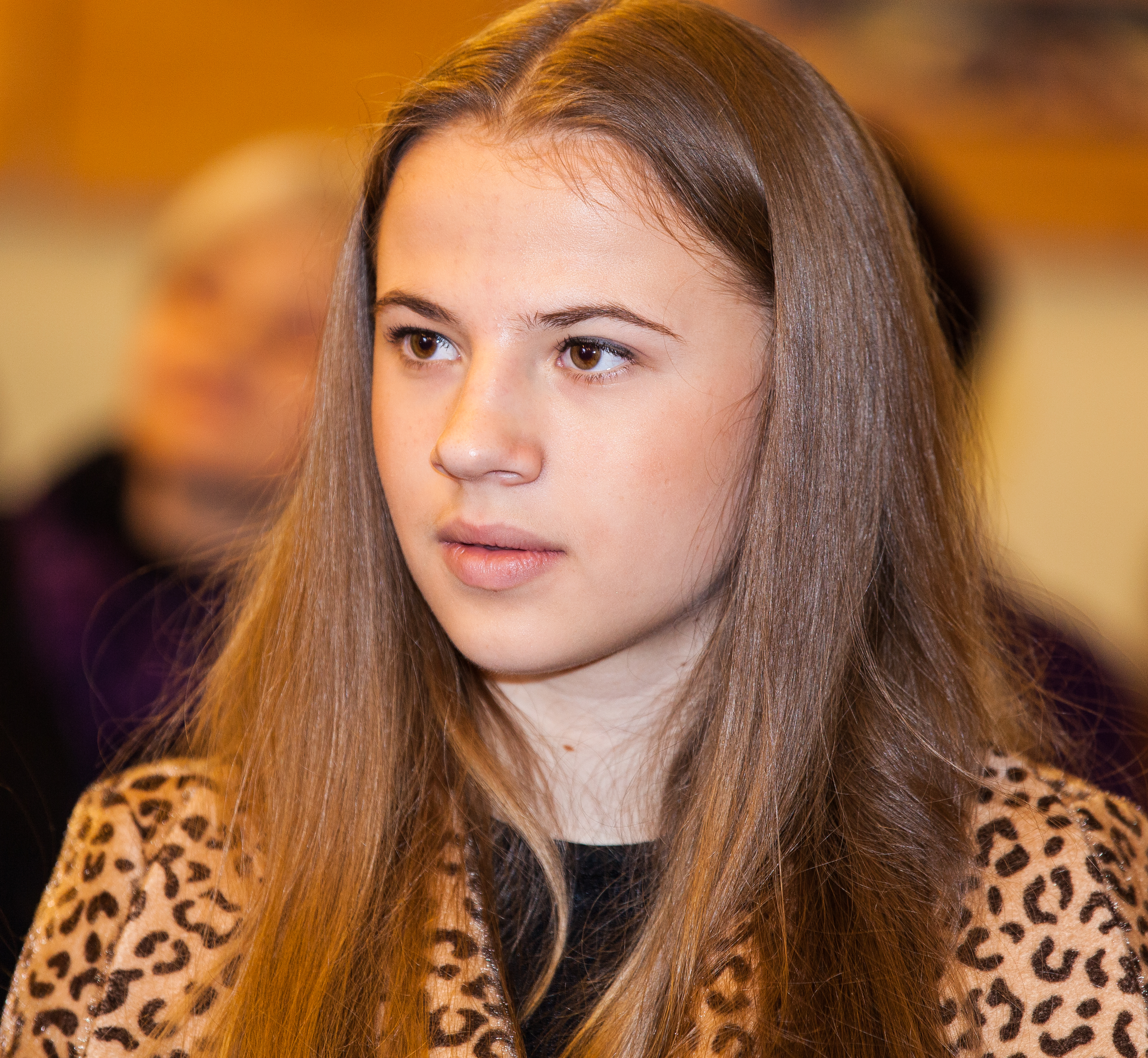 a cute Catholic girl in a church photographed in April 2014