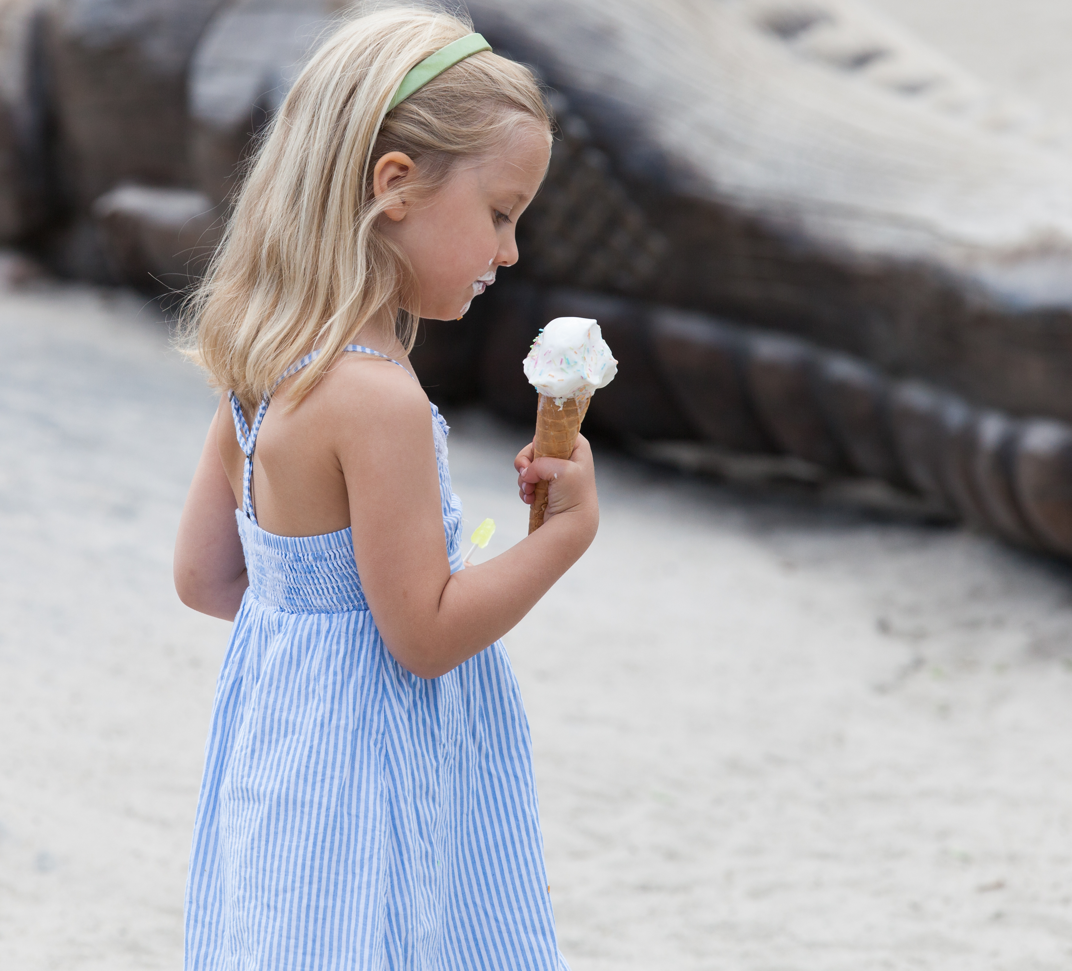 a fair-haired child girl eating ice-cream in Copenhagen, Denmark, in June 2014, picture 31