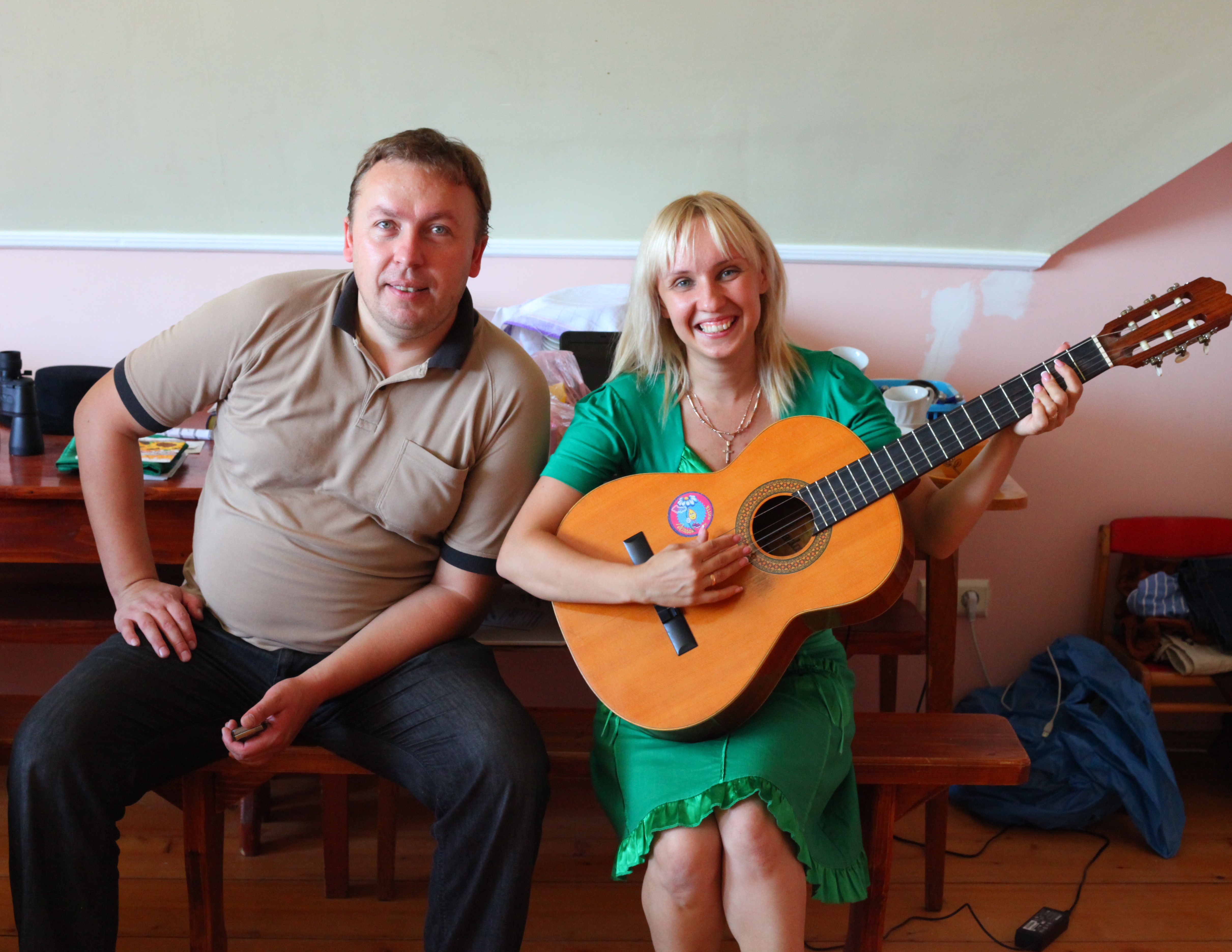 A man and a woman with a guitar