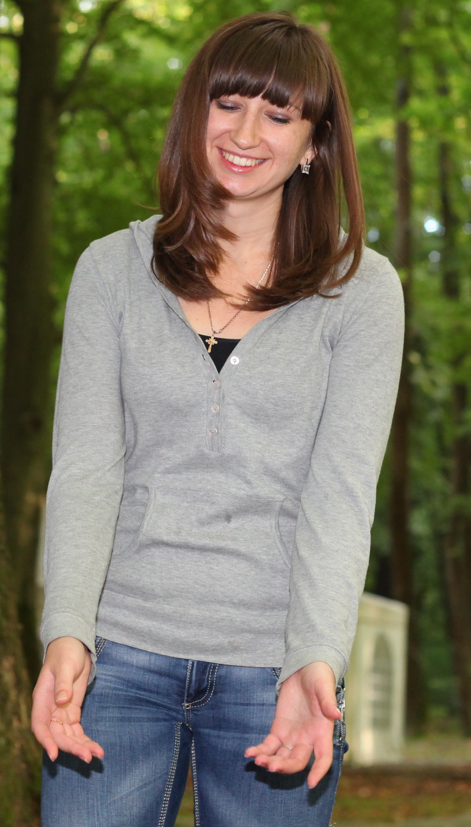 a beautiful charming cute brunette Catholic girl in nature