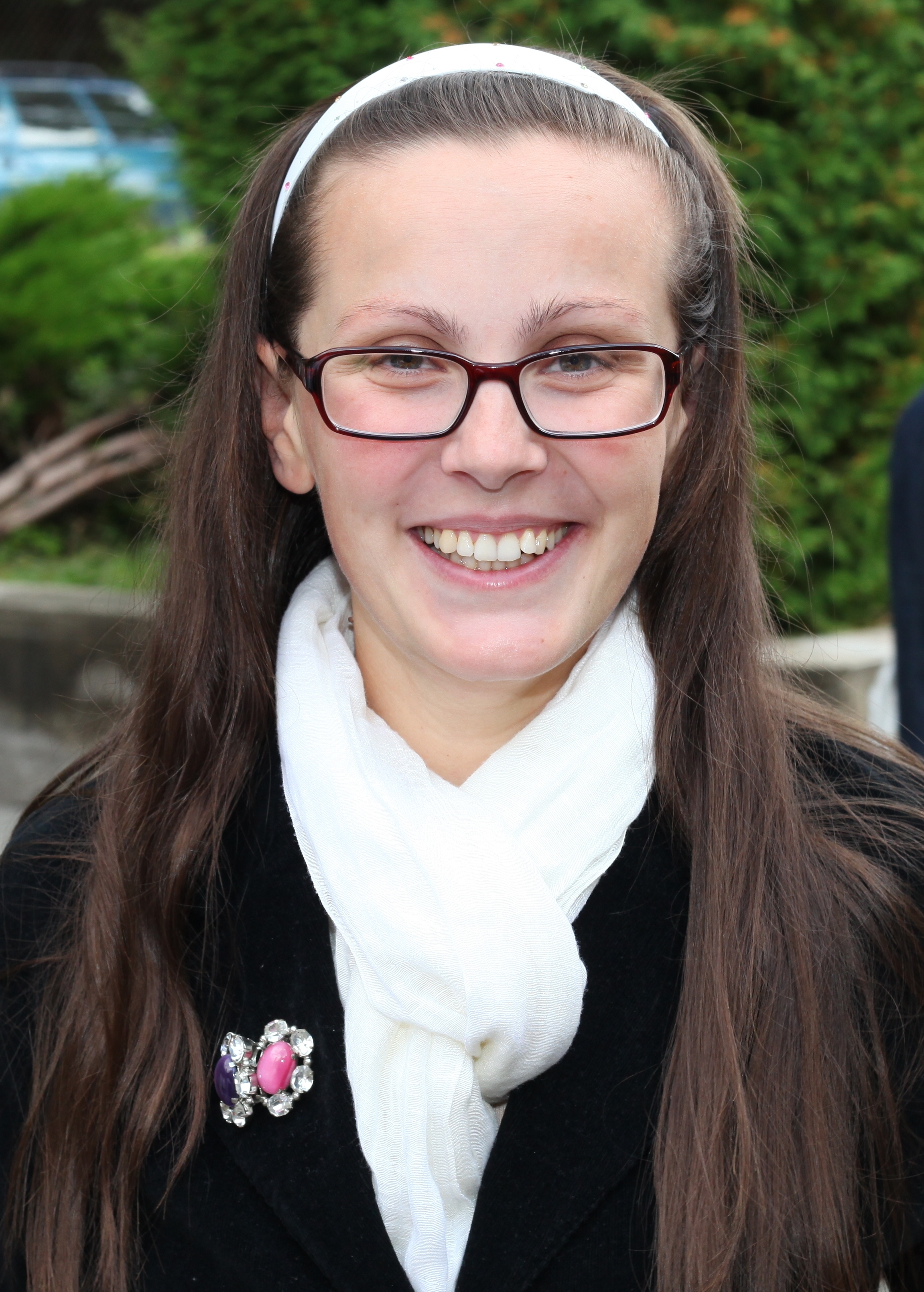 a young pretty smilling charming brunette Catholic woman