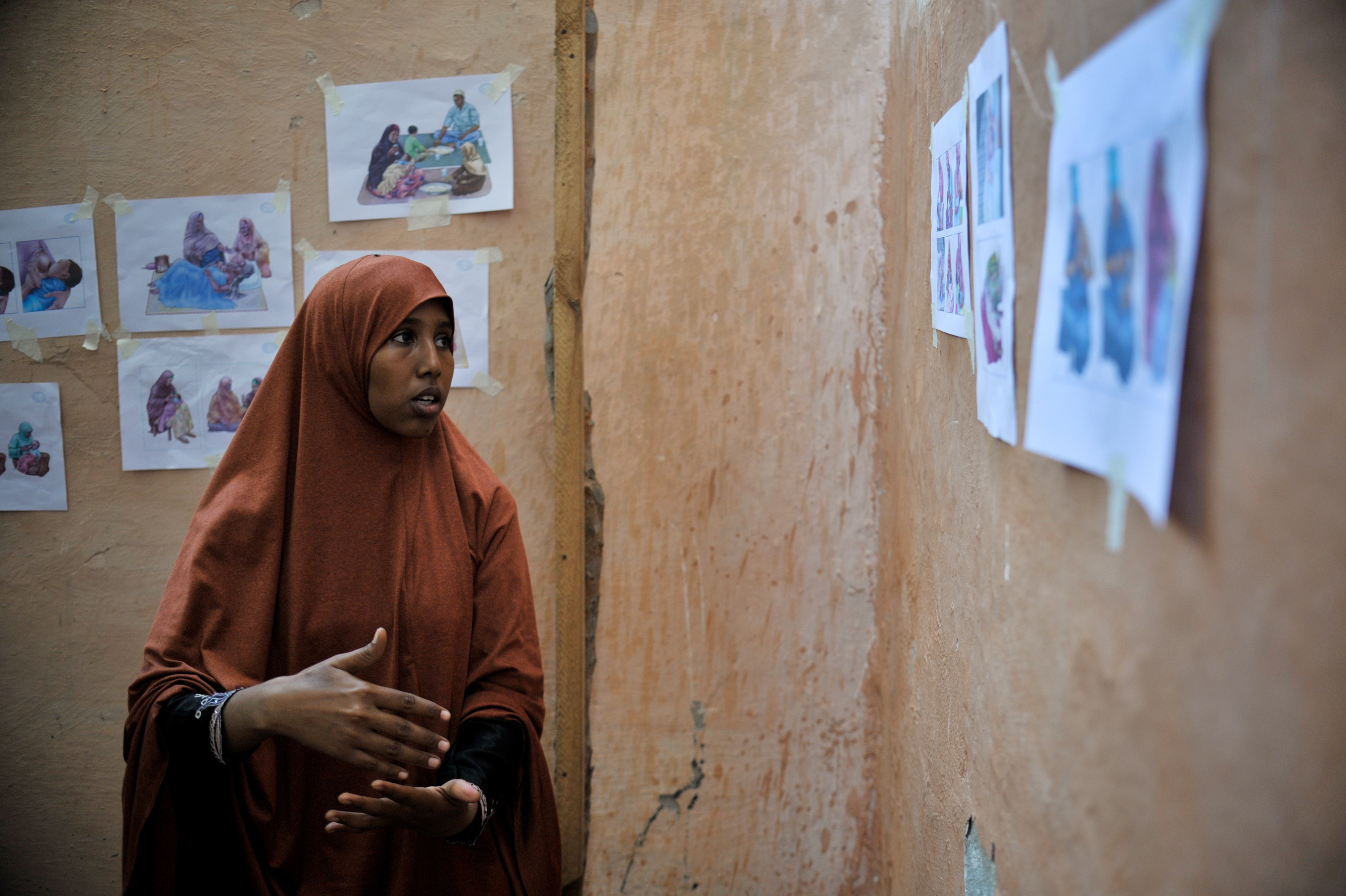 A woman at the Mother and Child Health Center teaches other women about post natal care during a visit to the hospital in Mogadishu, Somalia, by the Special Representative of the Secretary-General on (8621608162)