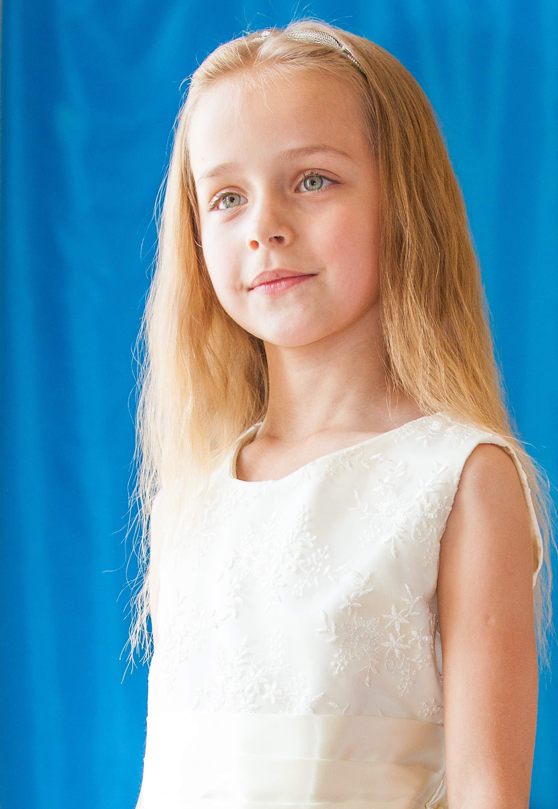 a young cute blond schoolgirl photographed in May 2014, picture 9/14