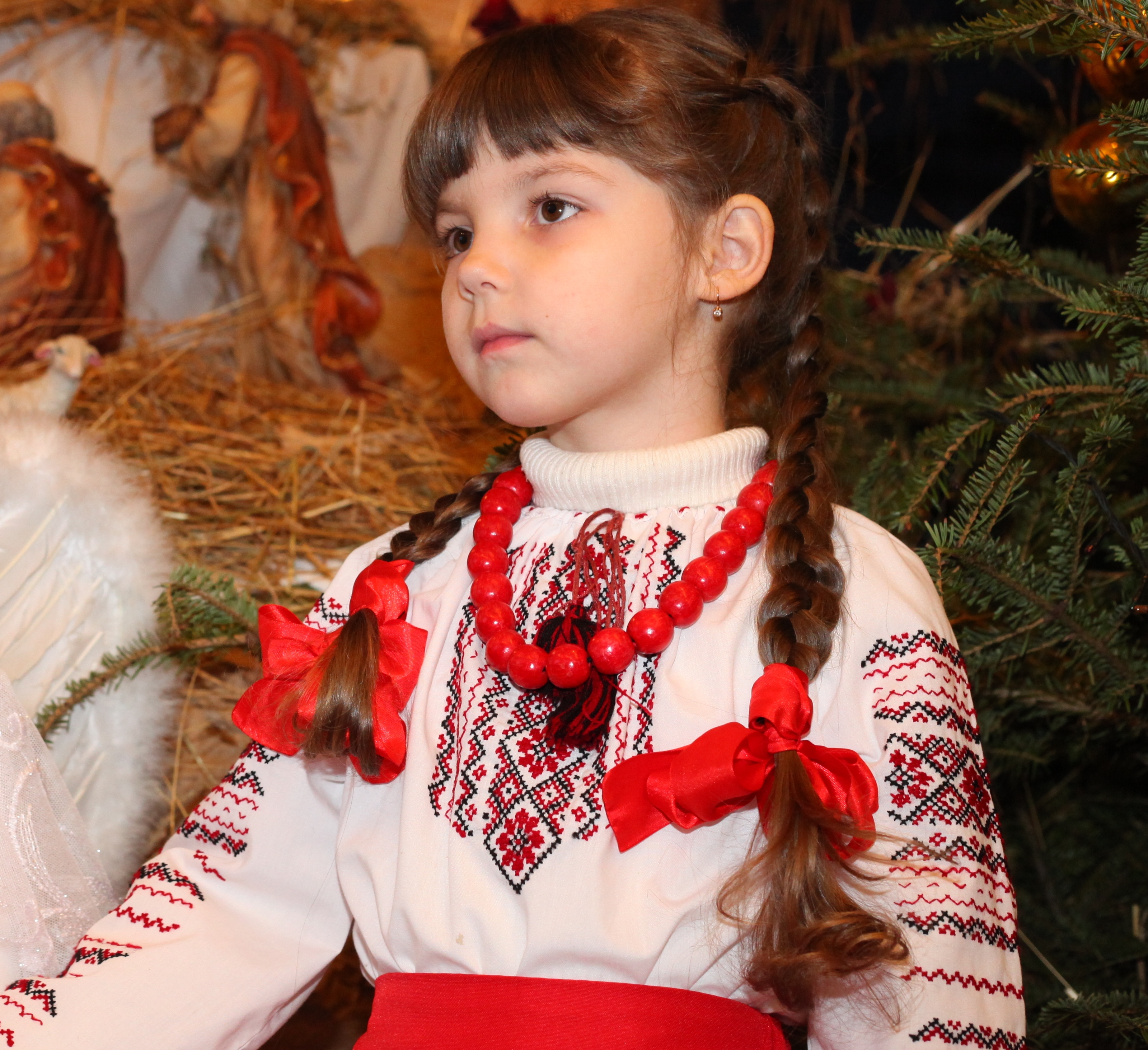 an amazingly beautiful brunette Catholic child girl performing in the Nativity scene, photo 2