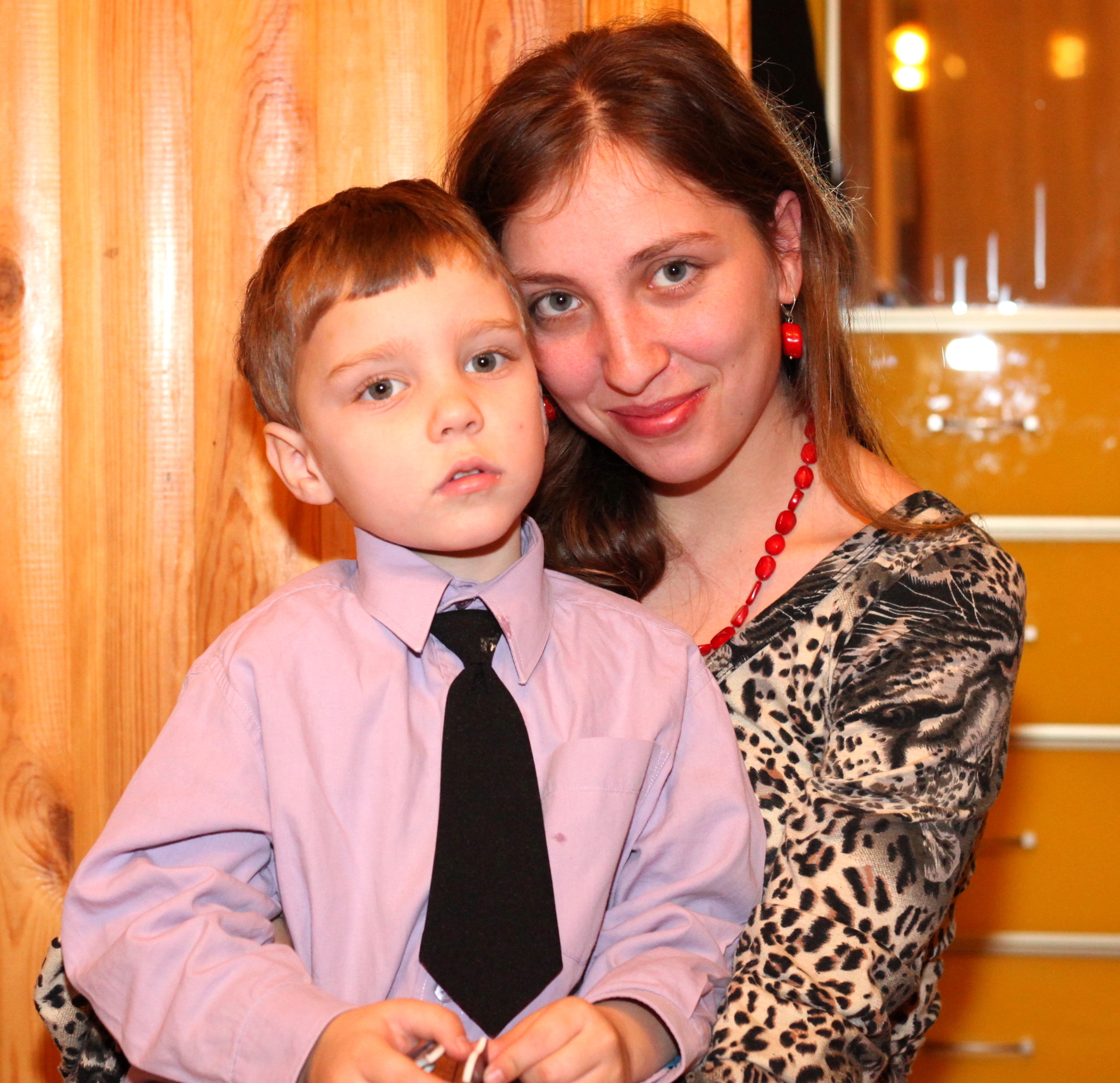 an appealing young brunette Catholic woman with her son, picture 2