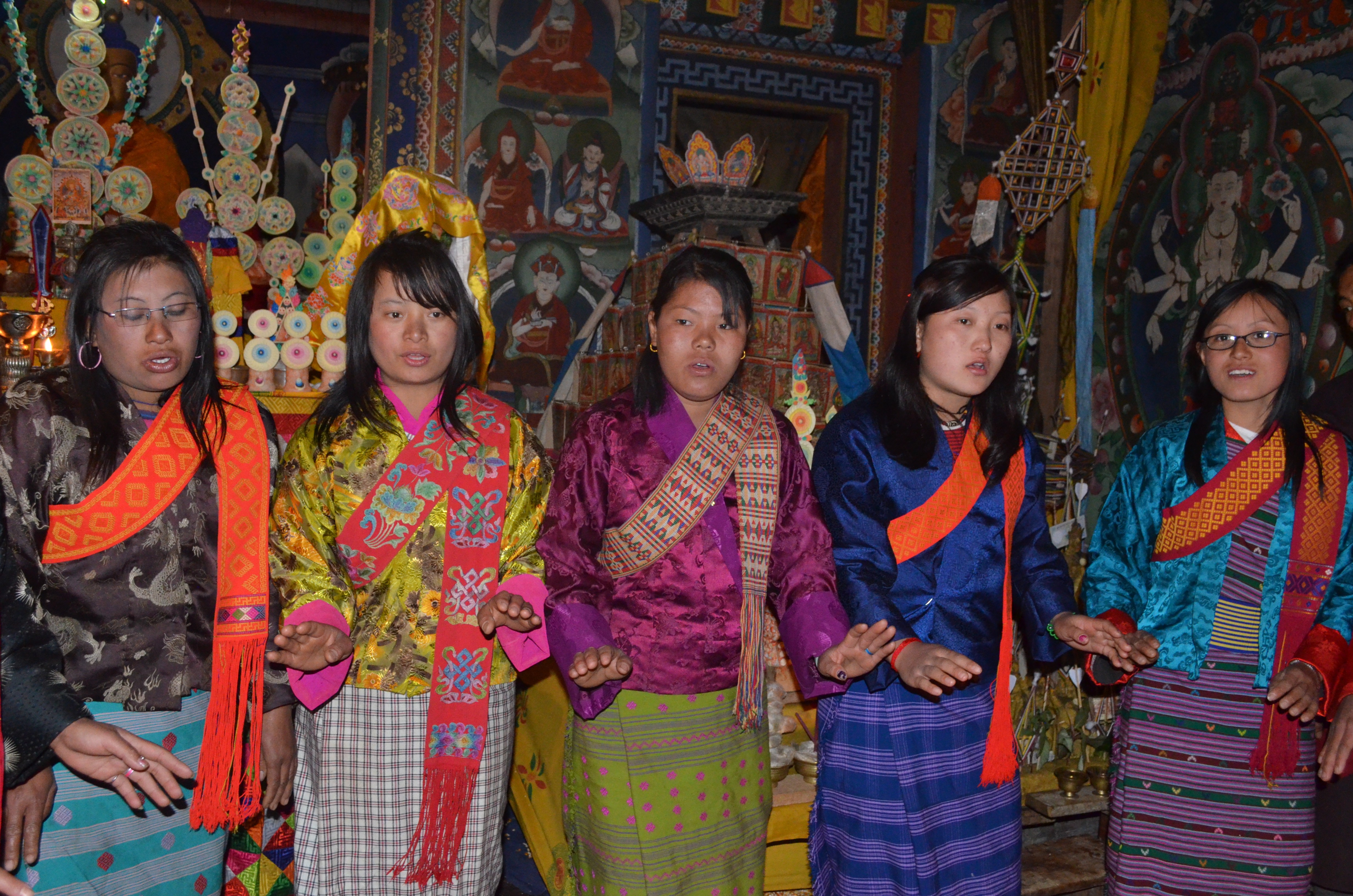 Bhutanese women dancing in temple