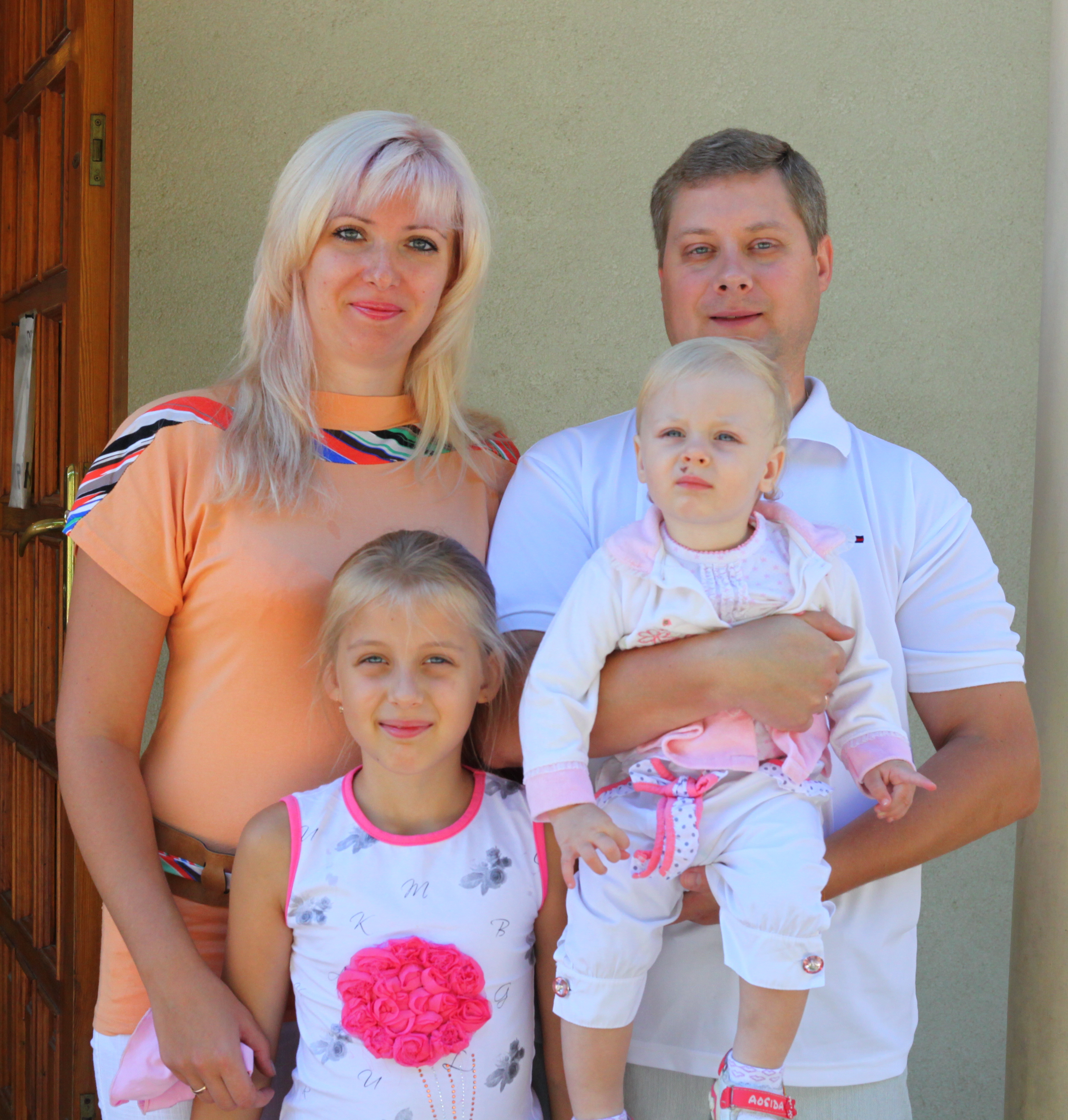 a Catholic family: mother, father and kids