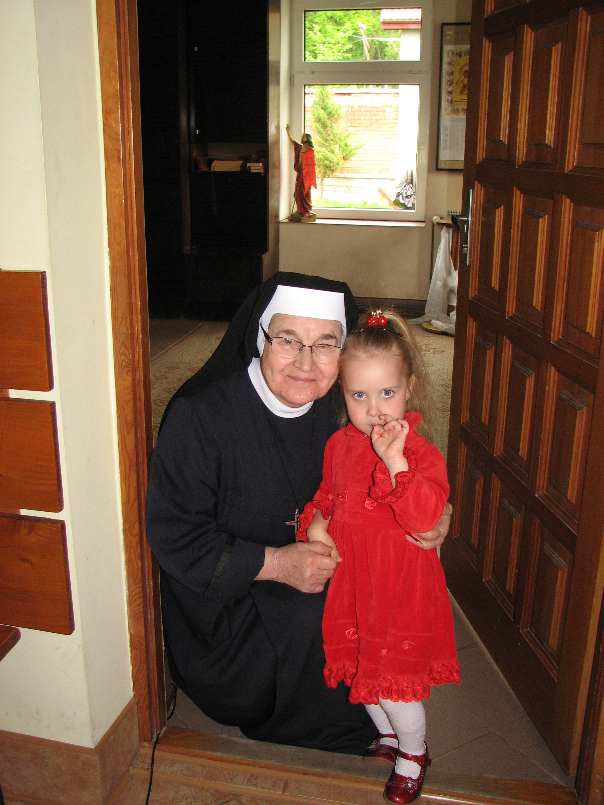 A Catholic nun with a Catholic child girl