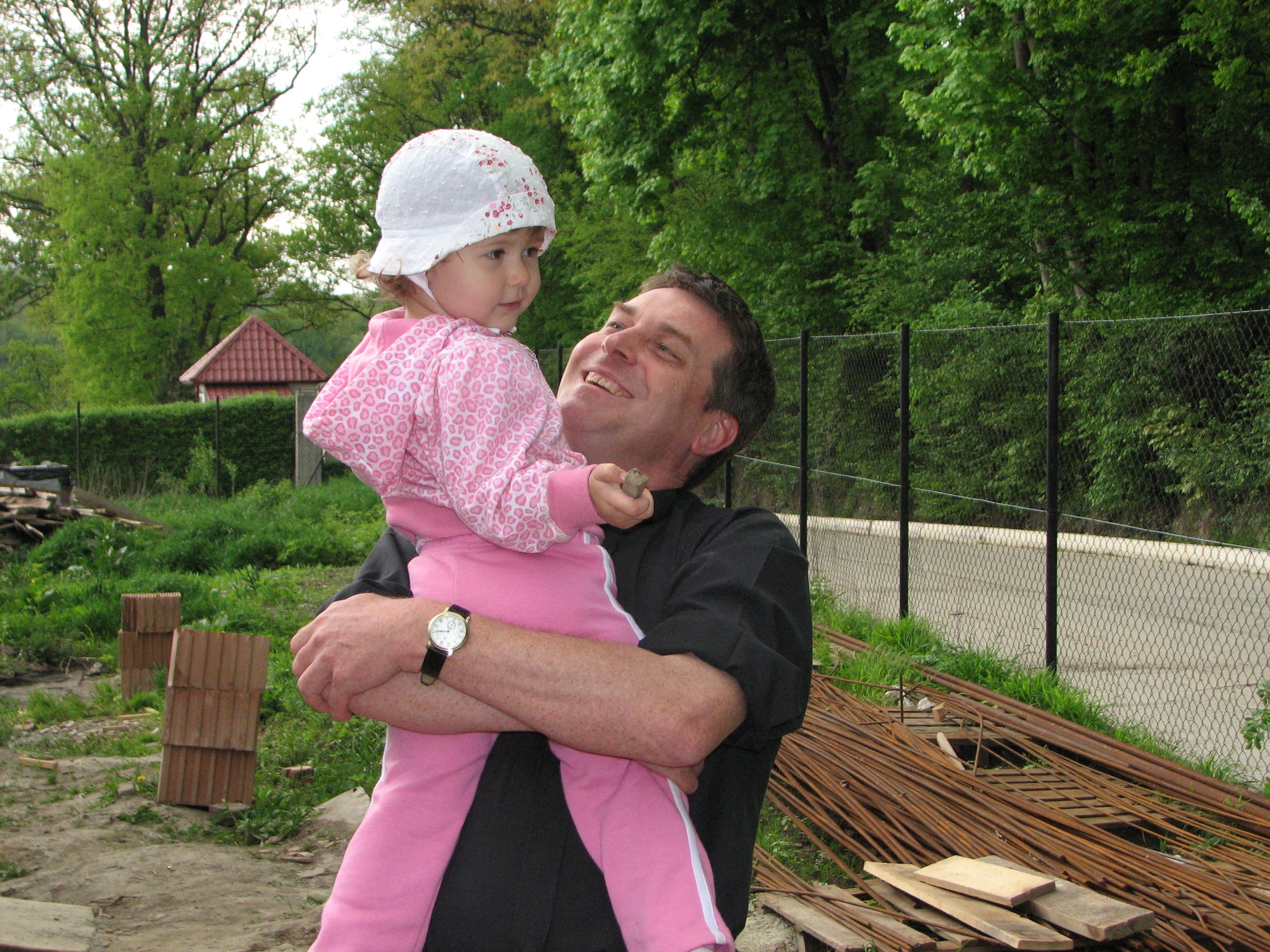 A Catholic priest with a small child girl