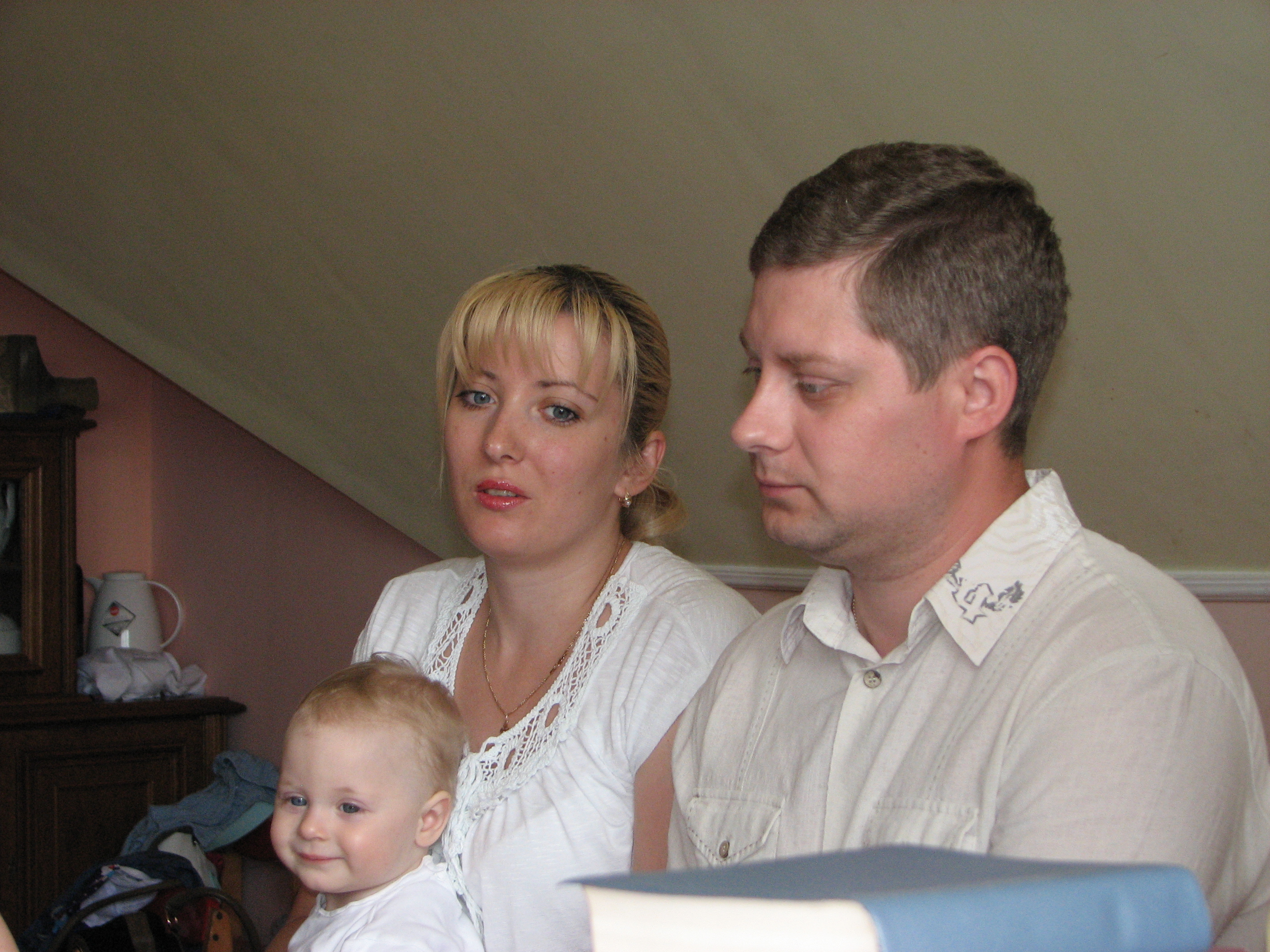 A young family at a meeting of Catholic married couples