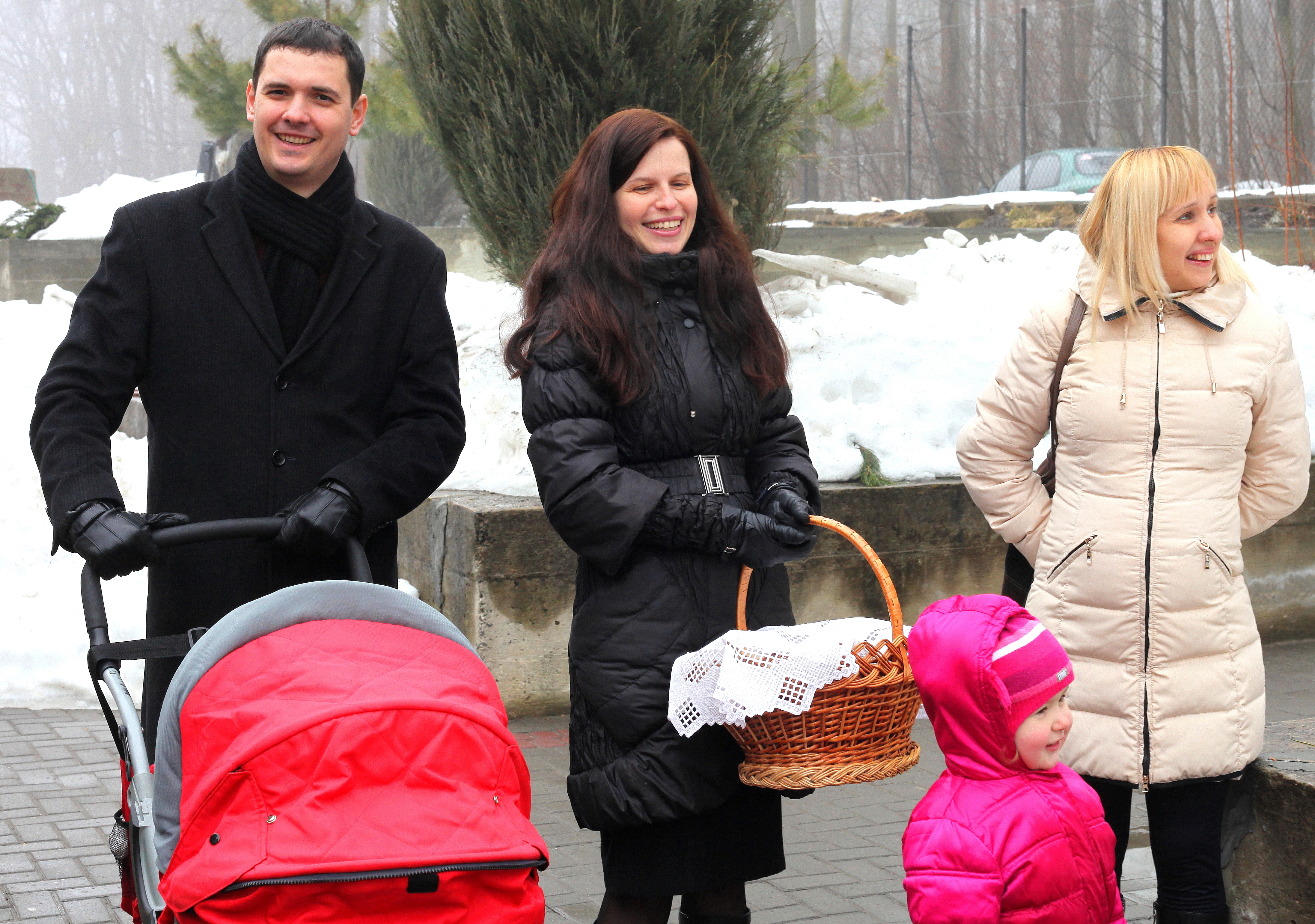 happy Catholic people near a Church