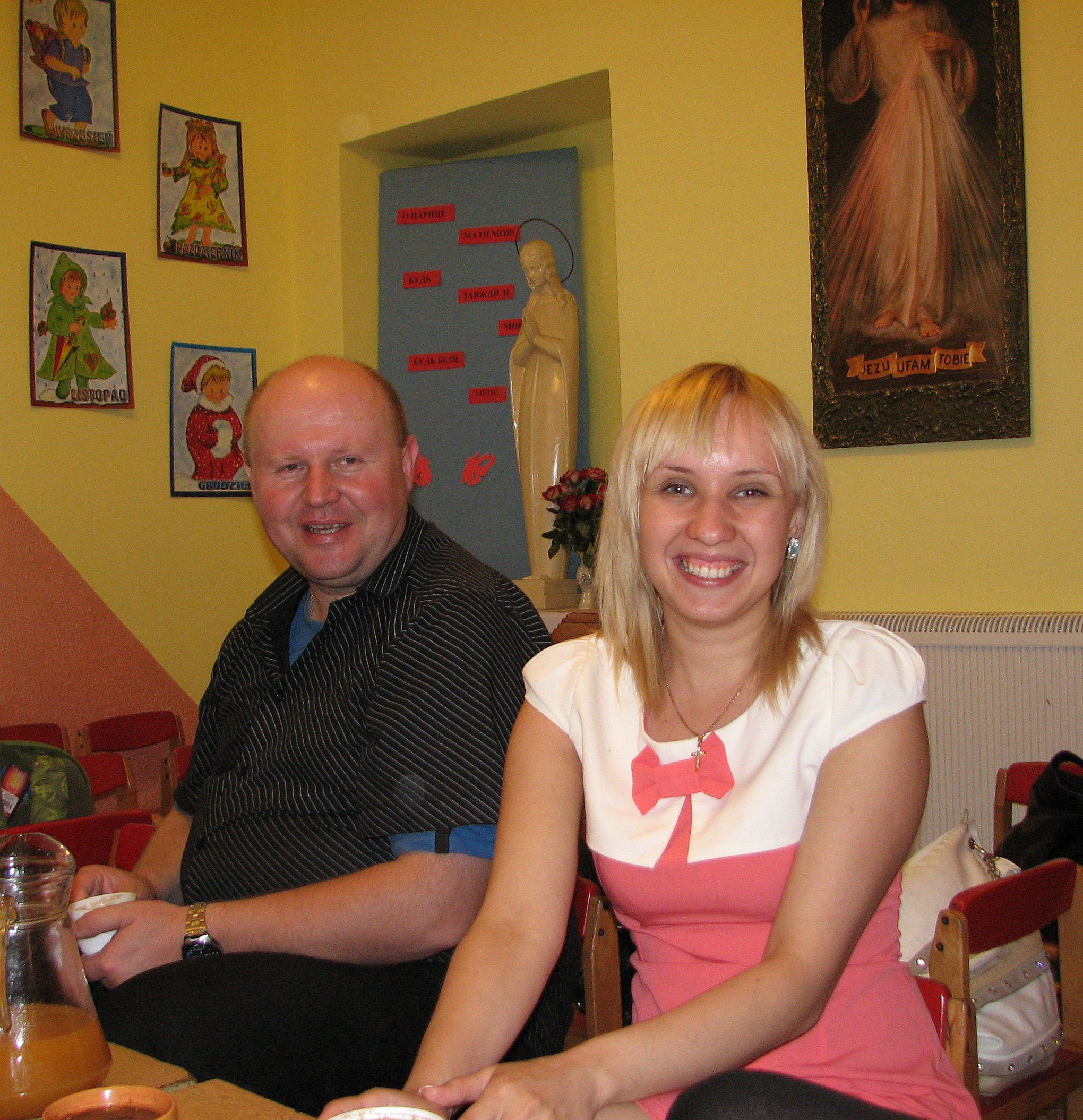A man and a smiling blond Catholic woman