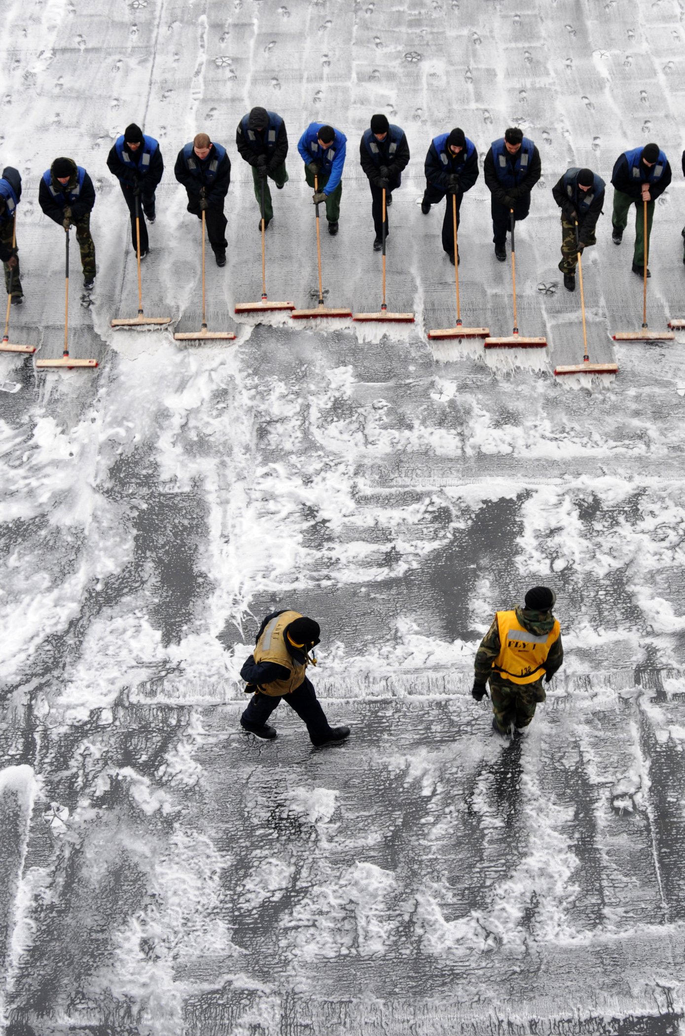 Defense.gov News Photo 110222-N-TB177-549 - Sailors assigned to the aircraft carrier USS George H.W. Bush CVN 77 participate in a scrubbing exercise on the ship s flight deck while underway