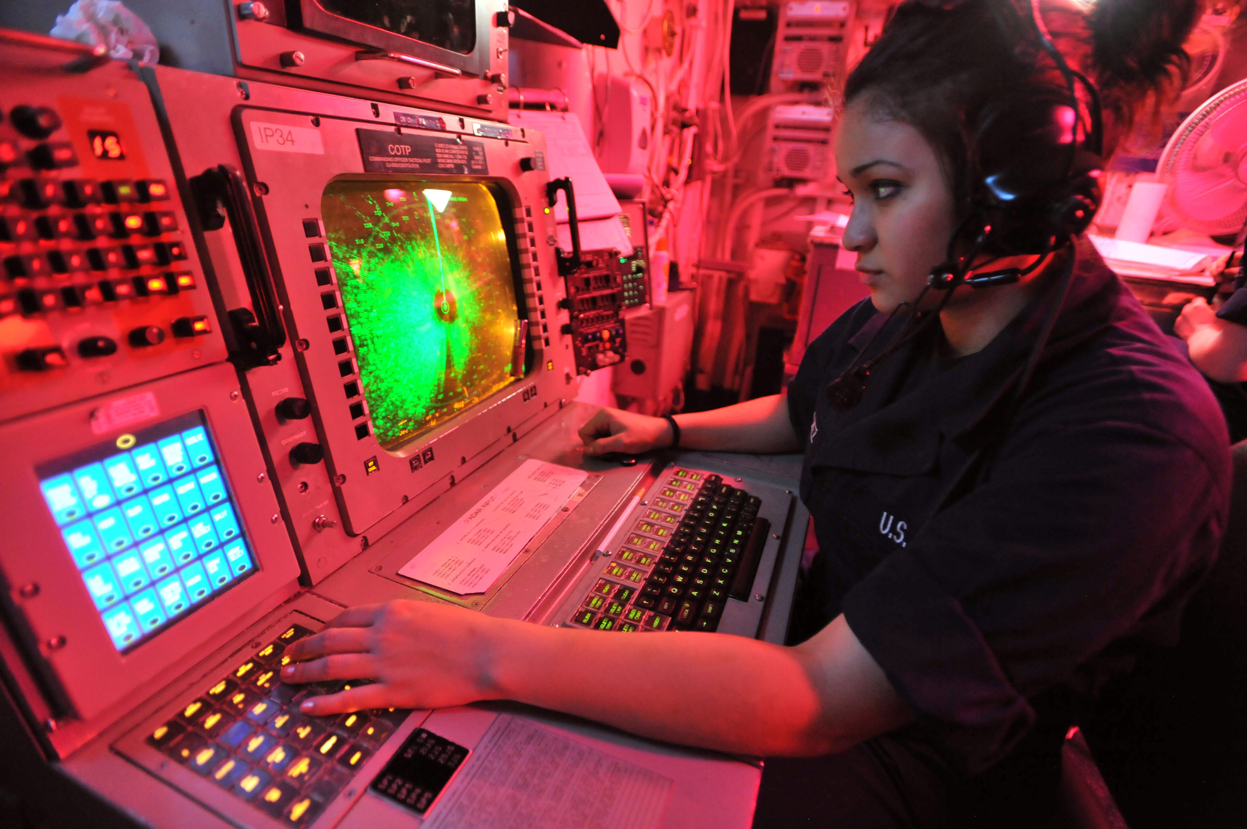 Defense.gov News Photo 110426-N-0569K-005 - Seaman Nathalie G. Sanchez operates an advanced combat direction system console in the commanding officer s tactical plot room aboard the aircraft