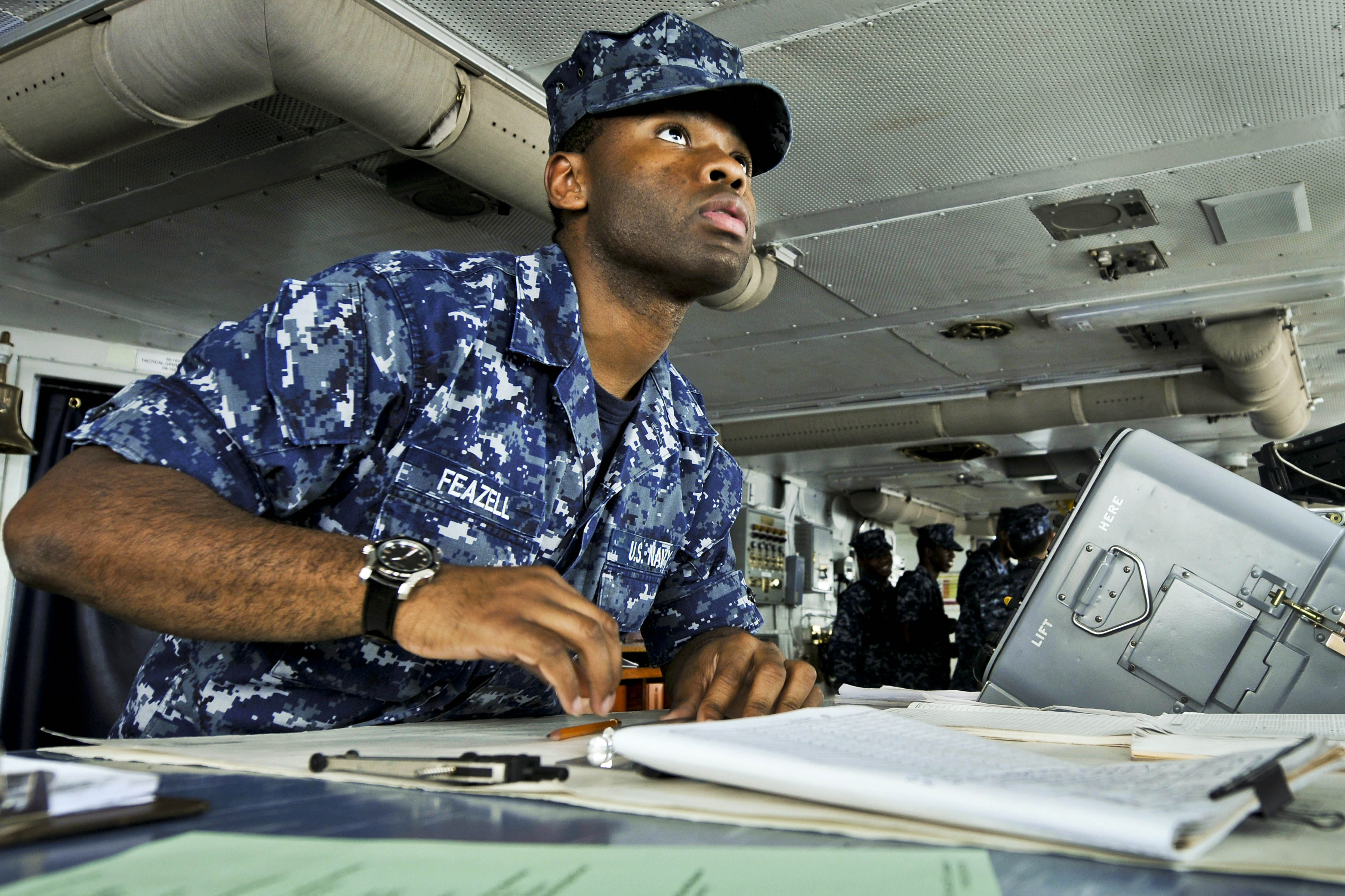 Defense.gov News Photo 120115-N-JN612-022 - U.S. Navy Seaman Roosevelt Feazell charts a course from the bridge of the aircraft carrier USS Abraham Lincoln in the U.S. 7th Fleet area of