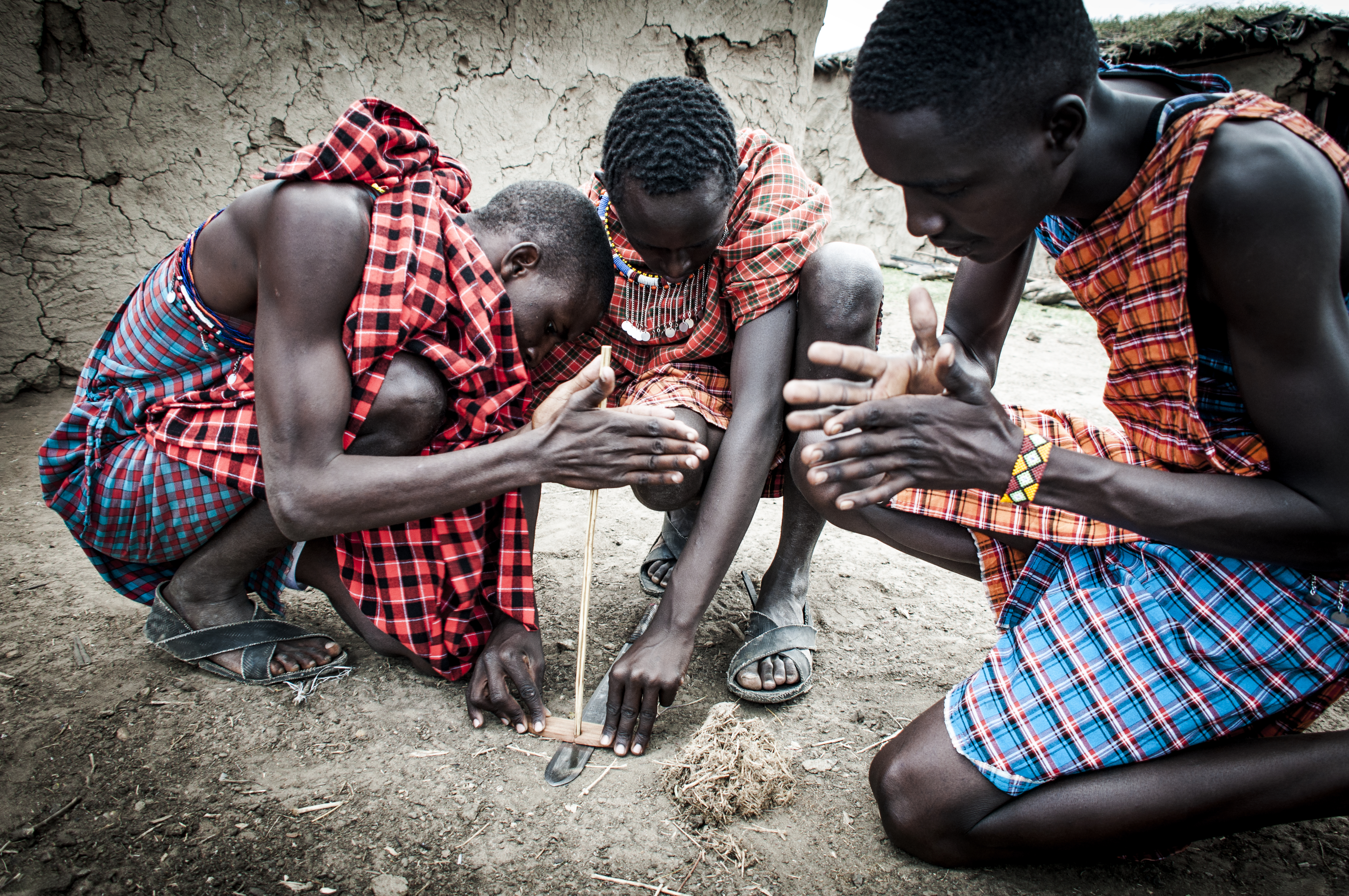 Masai warriors lighting a fire
