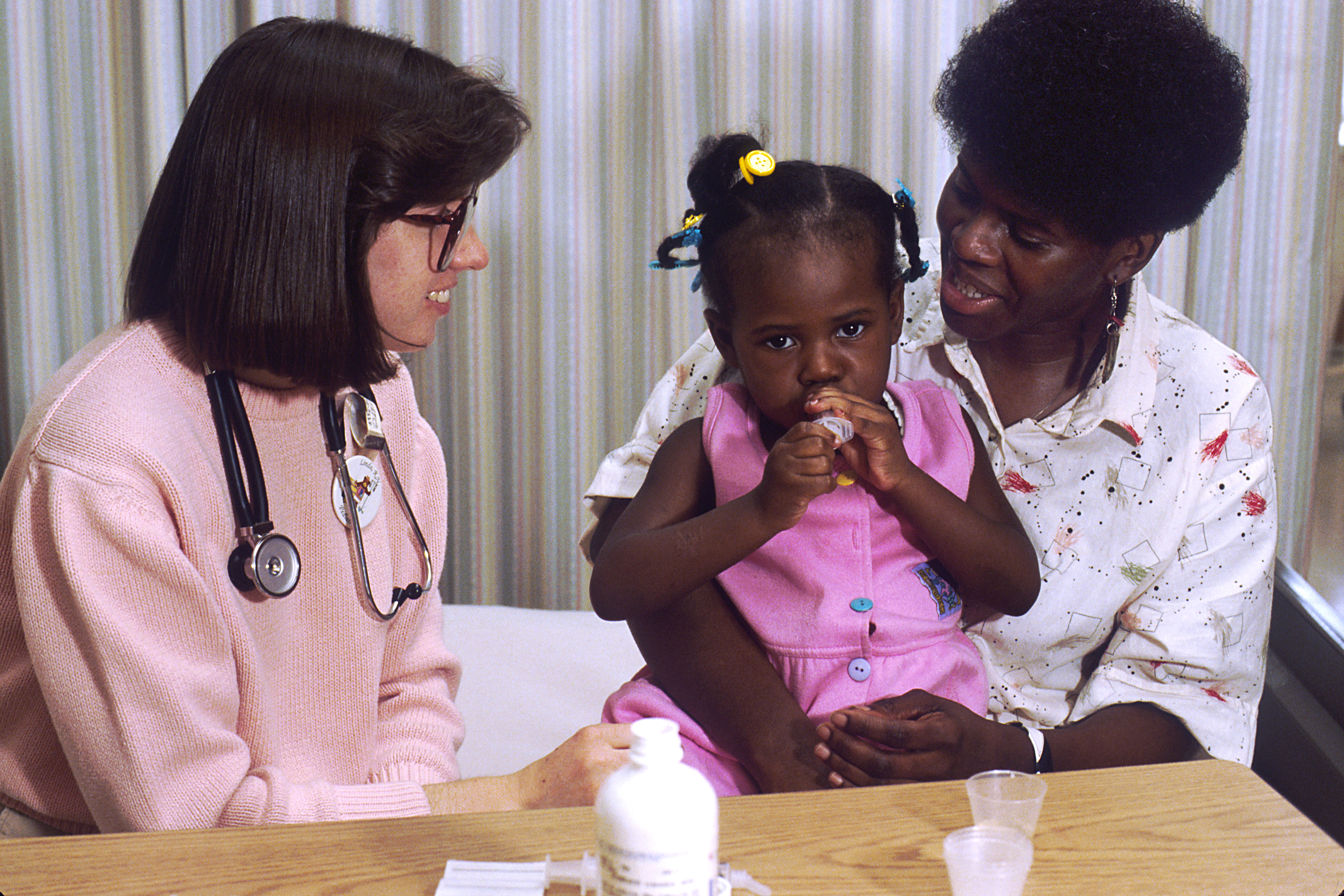 Nurse talks with mother