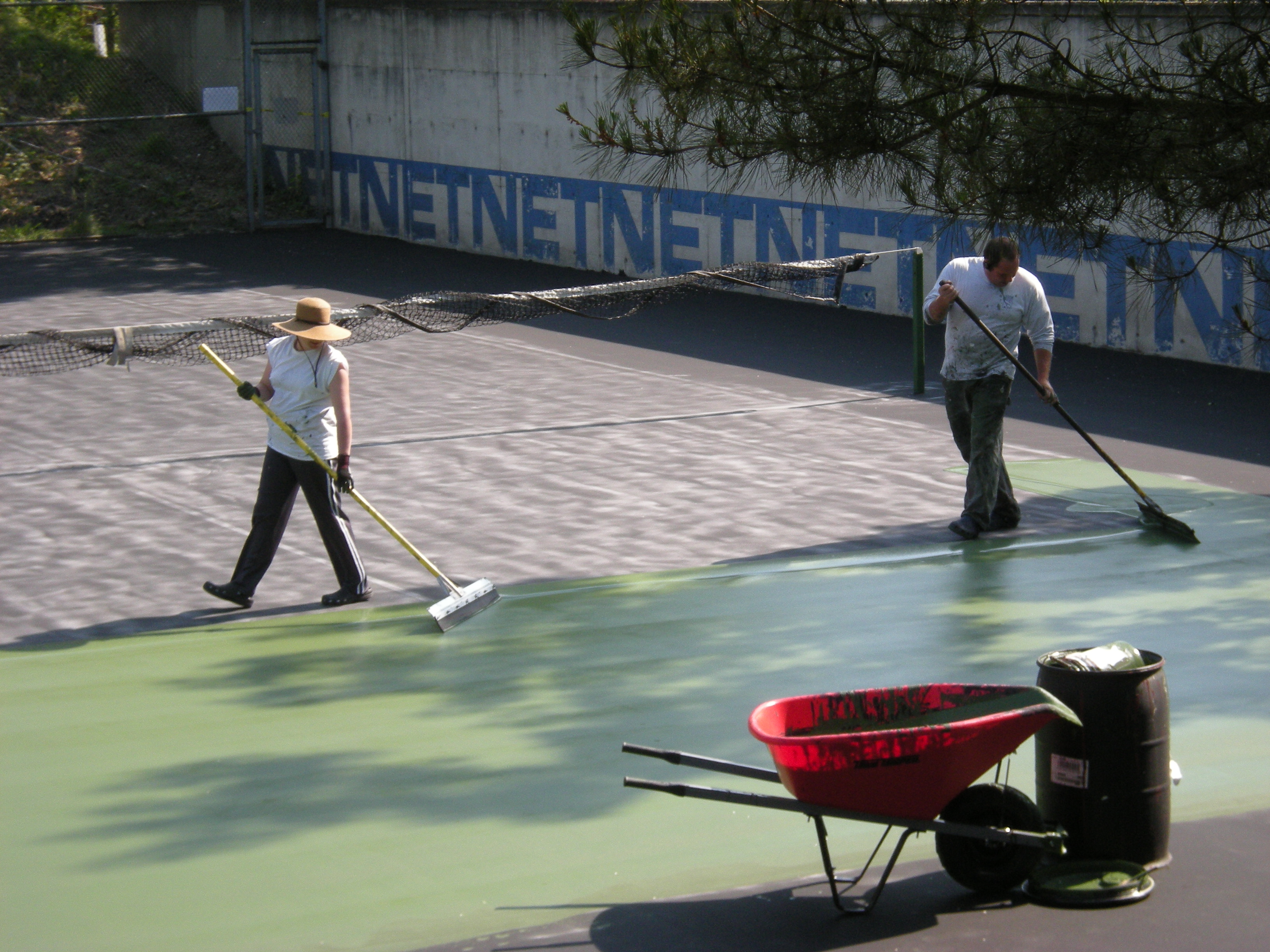 Painting surface of tennis court