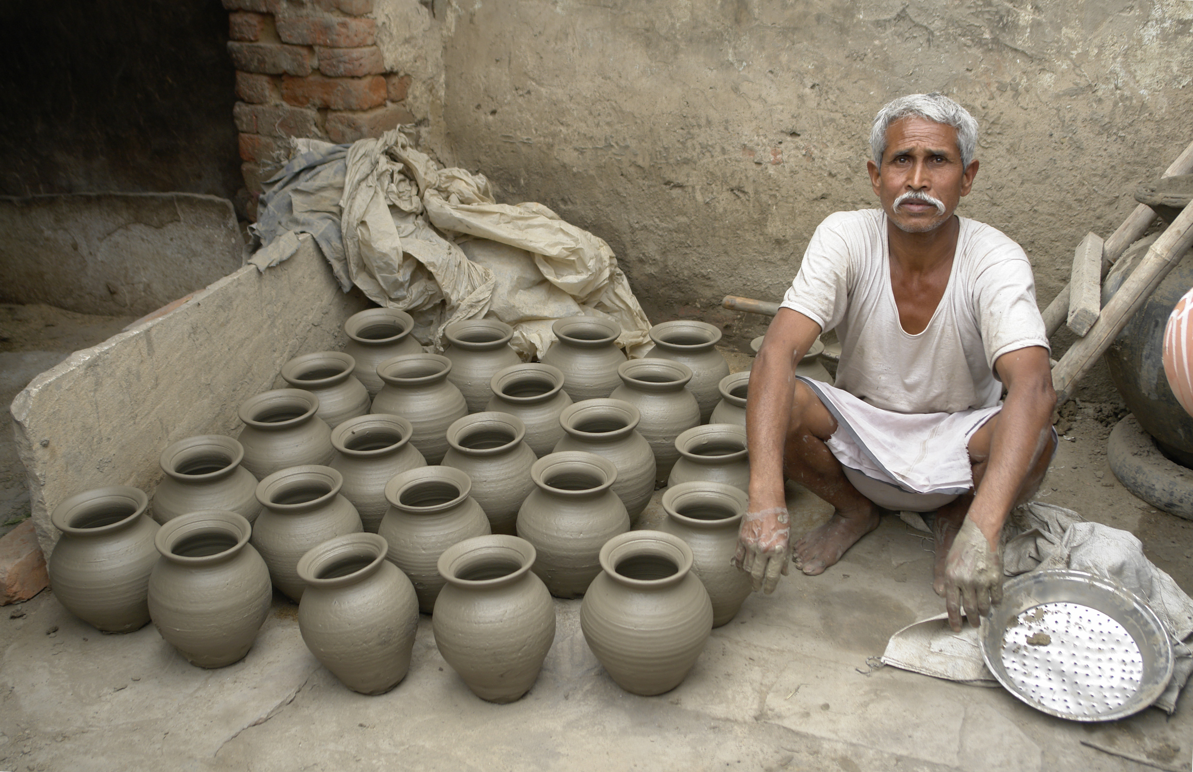 Potter and his work, Jaura, India