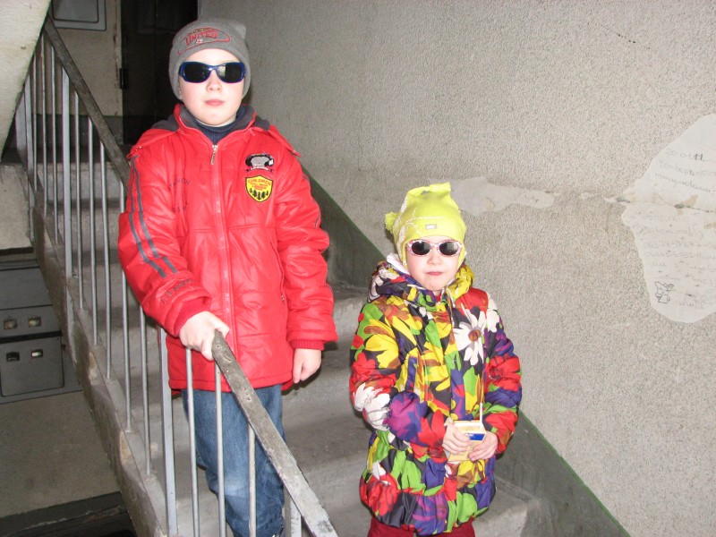 Catholic kids in an appartment block staircase, Lviv, Ukraine