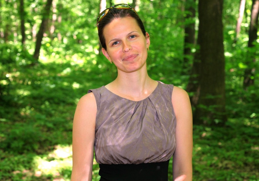 a beautiful brunette Catholic woman in a forest in May 2013, portrait 3/4