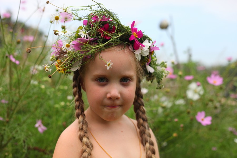 A child girl with a wreath of flowers, photo 2