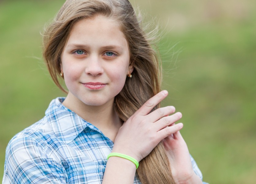 a cute blond 12-year-old girl photographed in April 2015, picture 6