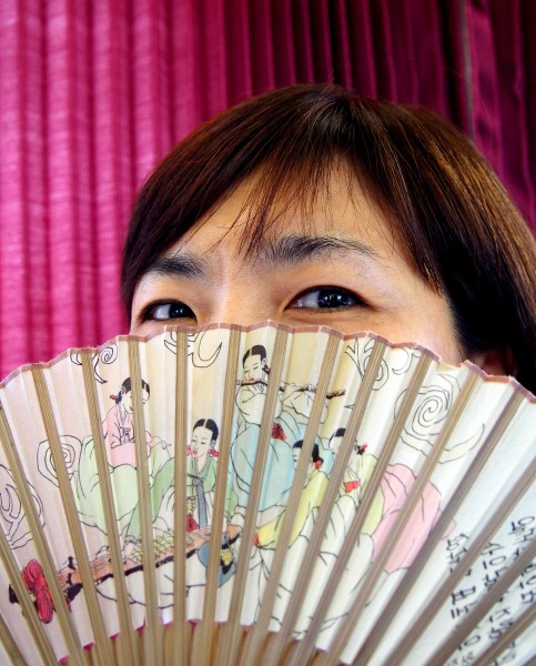A Korean woman with hand fan