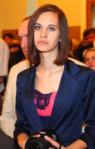 a portrait of a brunette girl at a Holy Mass in May 2013