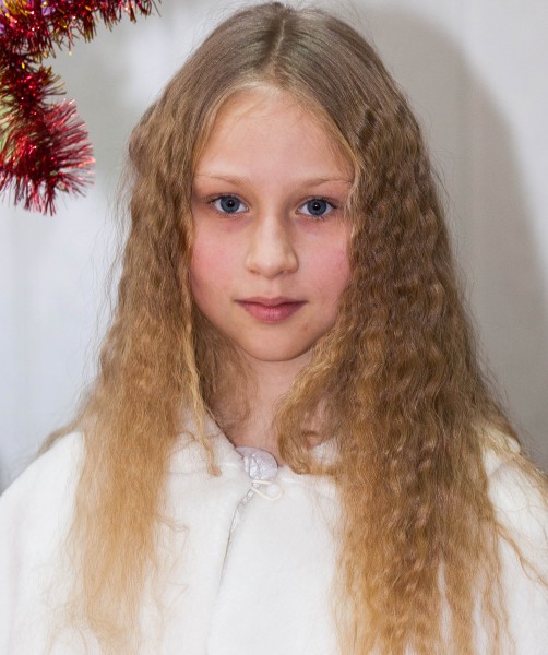 a young blond pretty schoolgirl photographed in December 2013, picture 3/6