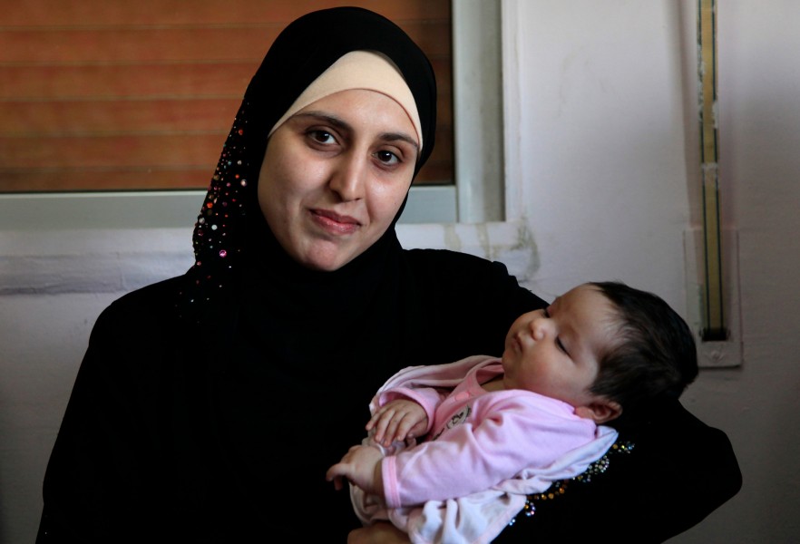A Syrian refugee and her newborn baby at a clinic in Ramtha, Jordan (9613483141)