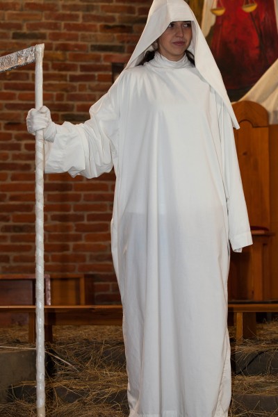 a young Catholic woman playing a role of death in December 2013