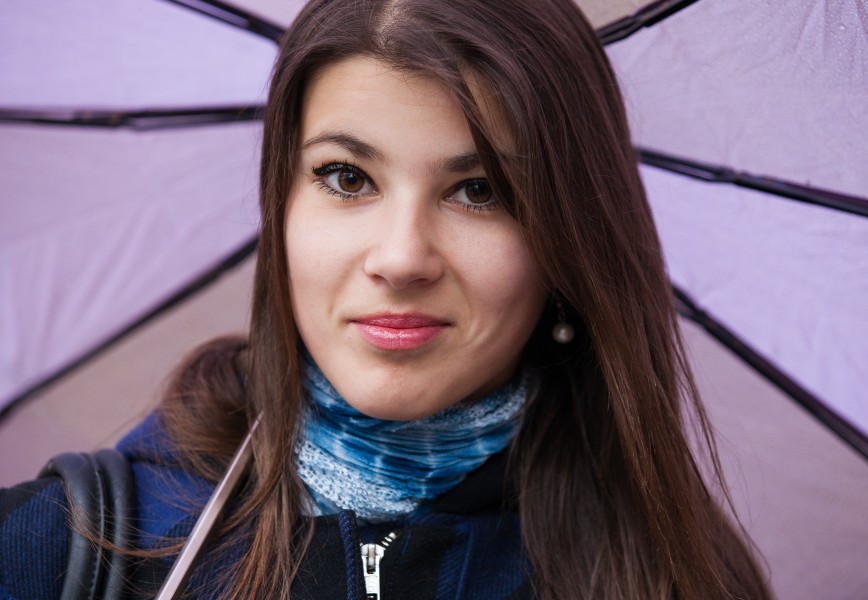 an exceptionally beautiful brunette Catholic girl with an umbrella photographed in November 2013, picture 2 out of 19