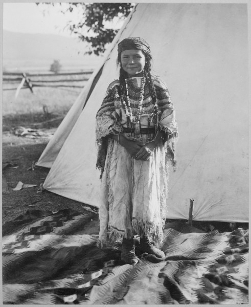 Angelic La Moose, whose grandfather was a Flathead chief, wearing costume her mother made, full-length, standing, in fro - NARA - 519156