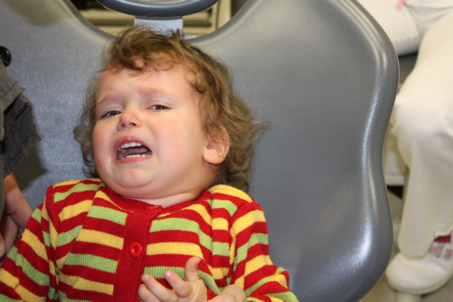 Angry child at dental treatment